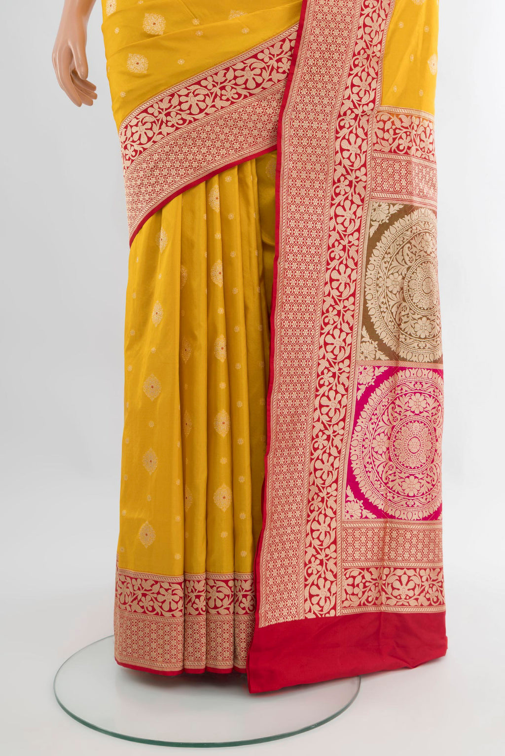 Pleats and pallu of Yellow Banarasi Silk Saree with Zari Butta on the body and Zari Border. 