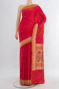 Pink with Orange Color Banarasi Silk Saree with Zari Butta on the body and Zari Border.  displayed on a mannequin