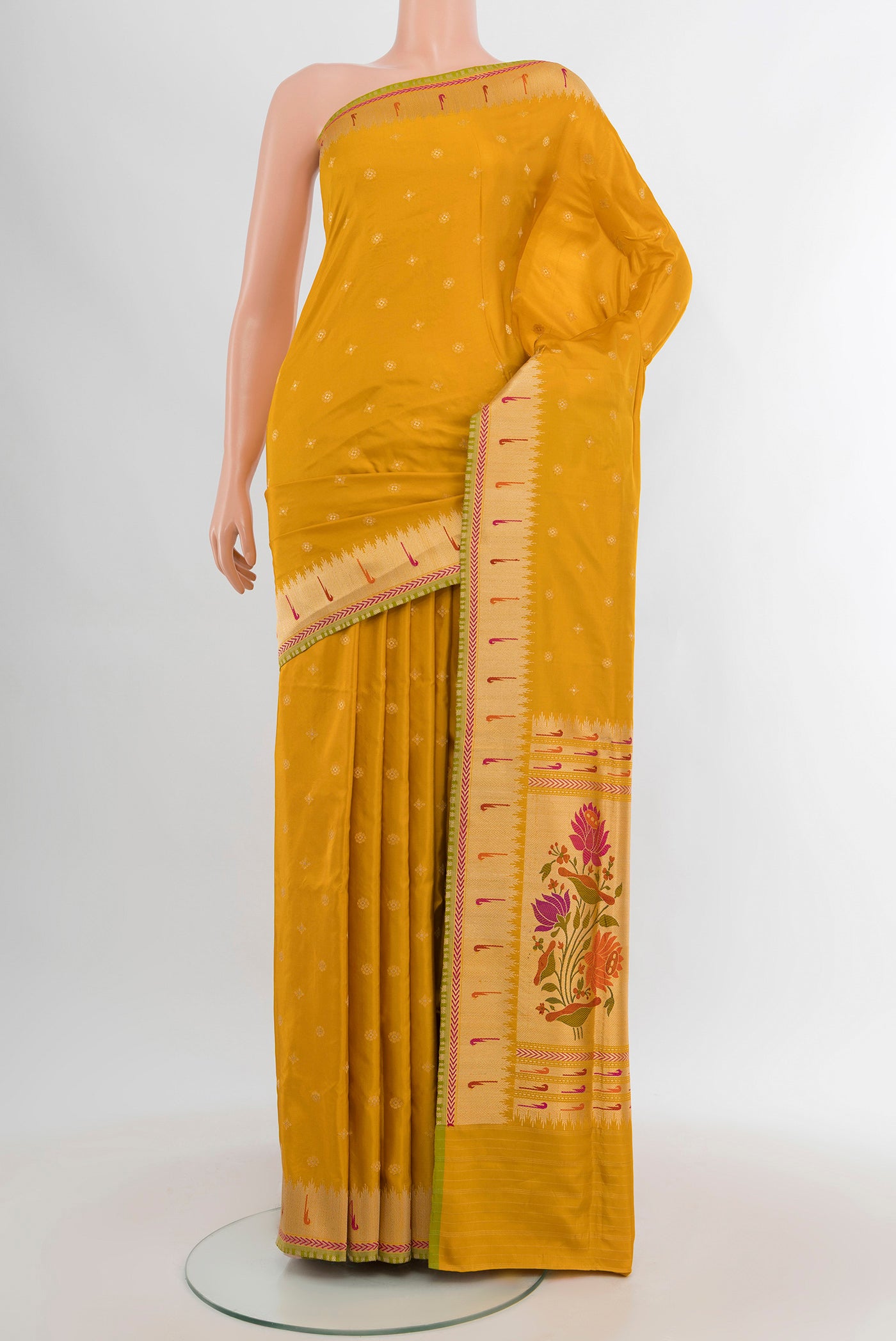 Yellow Banarasi Silk Saree with Zari Butta on the body and Zari Border.  displayed on a mannequin