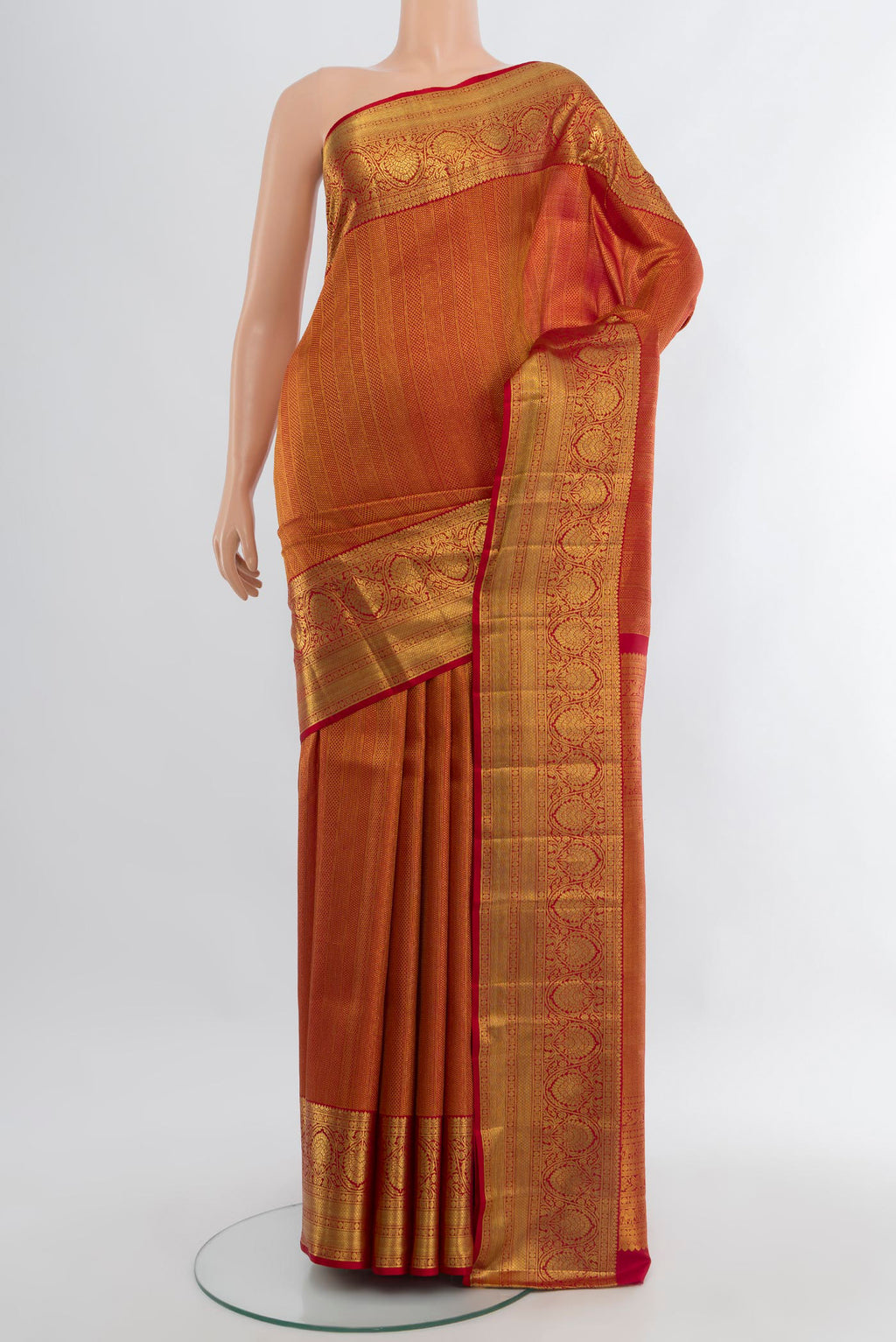 Maroon Kanchipuram Silk Saree with Zari Brocade on the body and Zari Border.  displayed on a mannequin