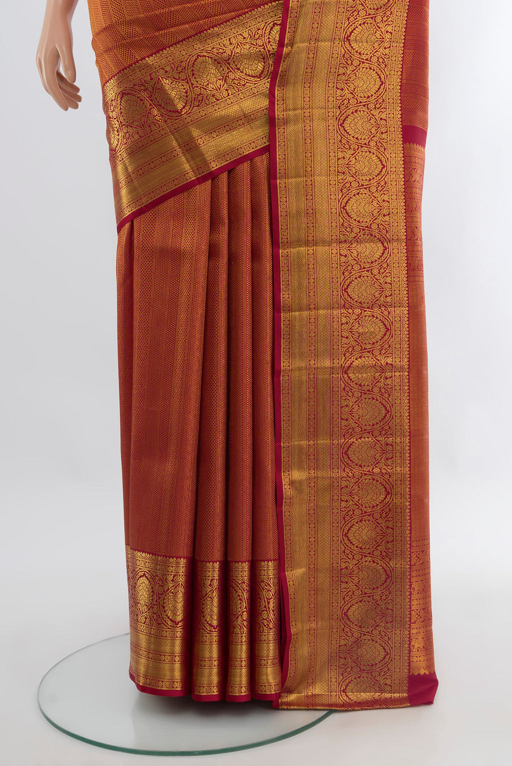 Pleats and pallu of Maroon Kanchipuram Silk Saree with Zari Brocade on the body and Zari Border. 
