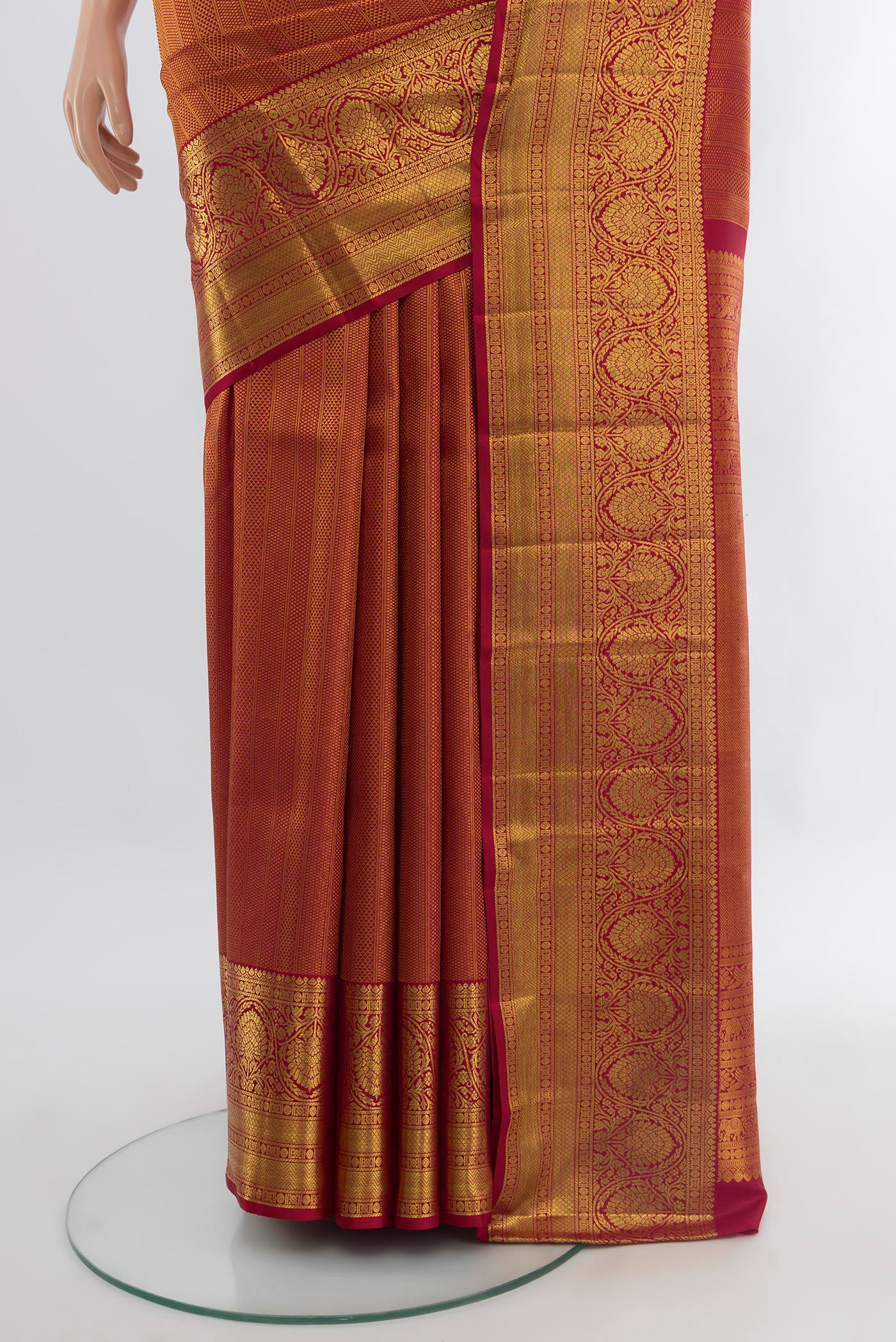 Pleats and pallu of Maroon Kanchipuram Silk Saree with Zari Brocade on the body and Zari Border. 