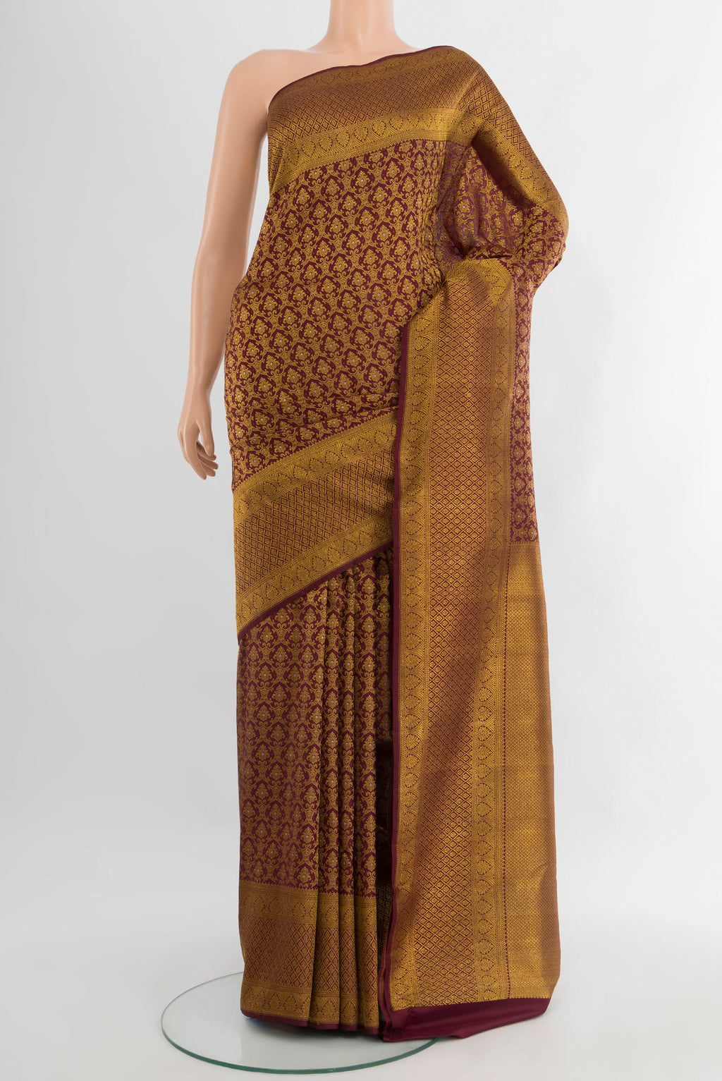 Coffee Brown Kanchipuram Silk Saree with Zari Brocade on the body and Zari Border.  displayed on a mannequin