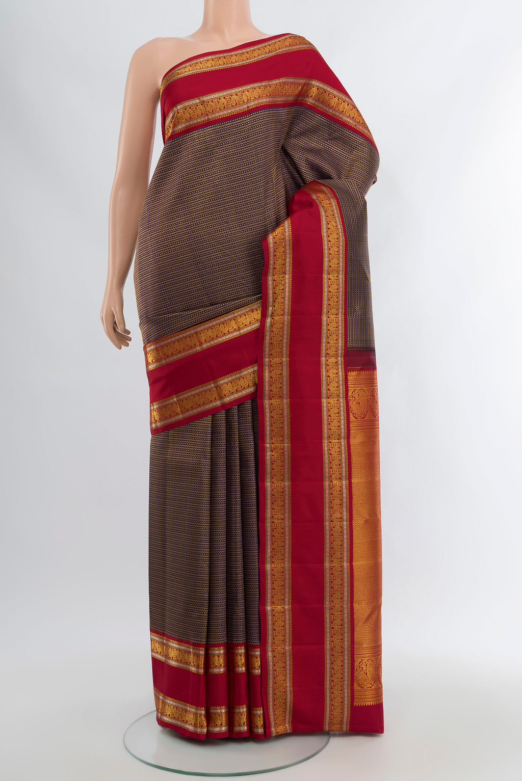 Violet Kanchipuram Silk Saree with Zari Brocade on the body and Zari Border.  displayed on a mannequin