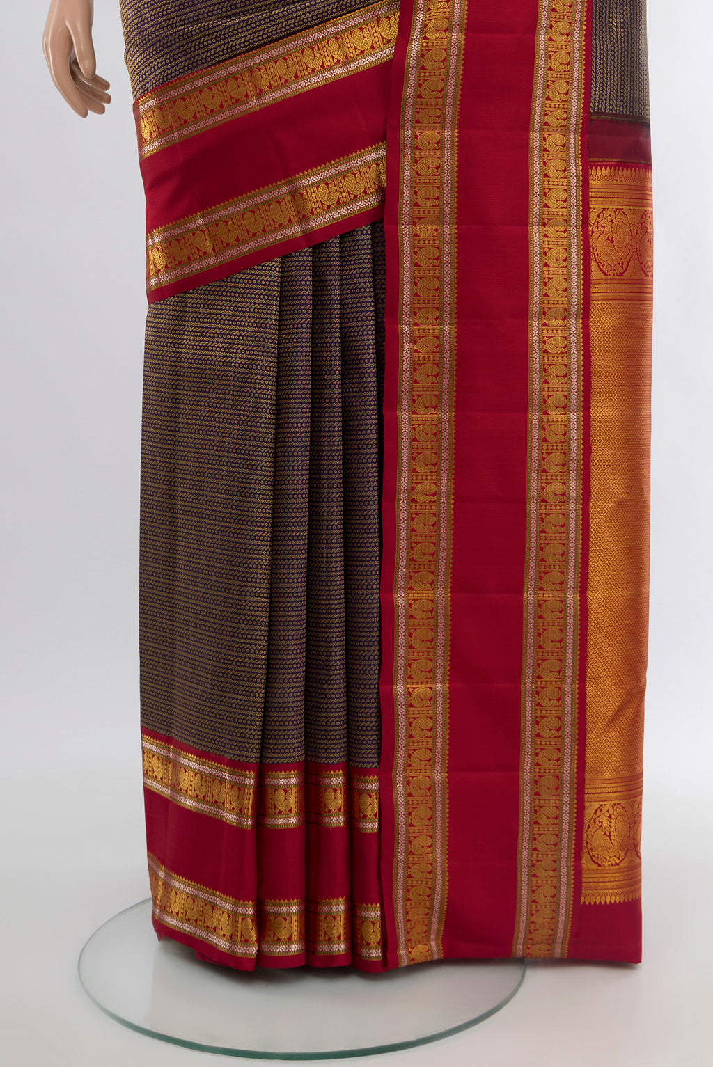 Pleats and pallu of Violet Kanchipuram Silk Saree with Zari Brocade on the body and Zari Border. 