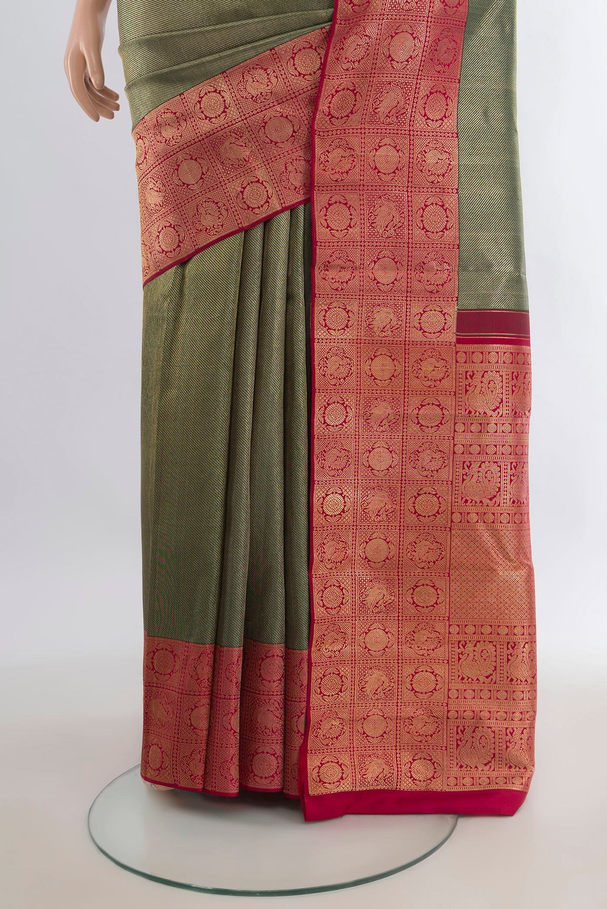 Pleats and pallu of Pure Silk Bottle Green Kanchipuram Saree with Zari Brocade on the body and Zari Border. 