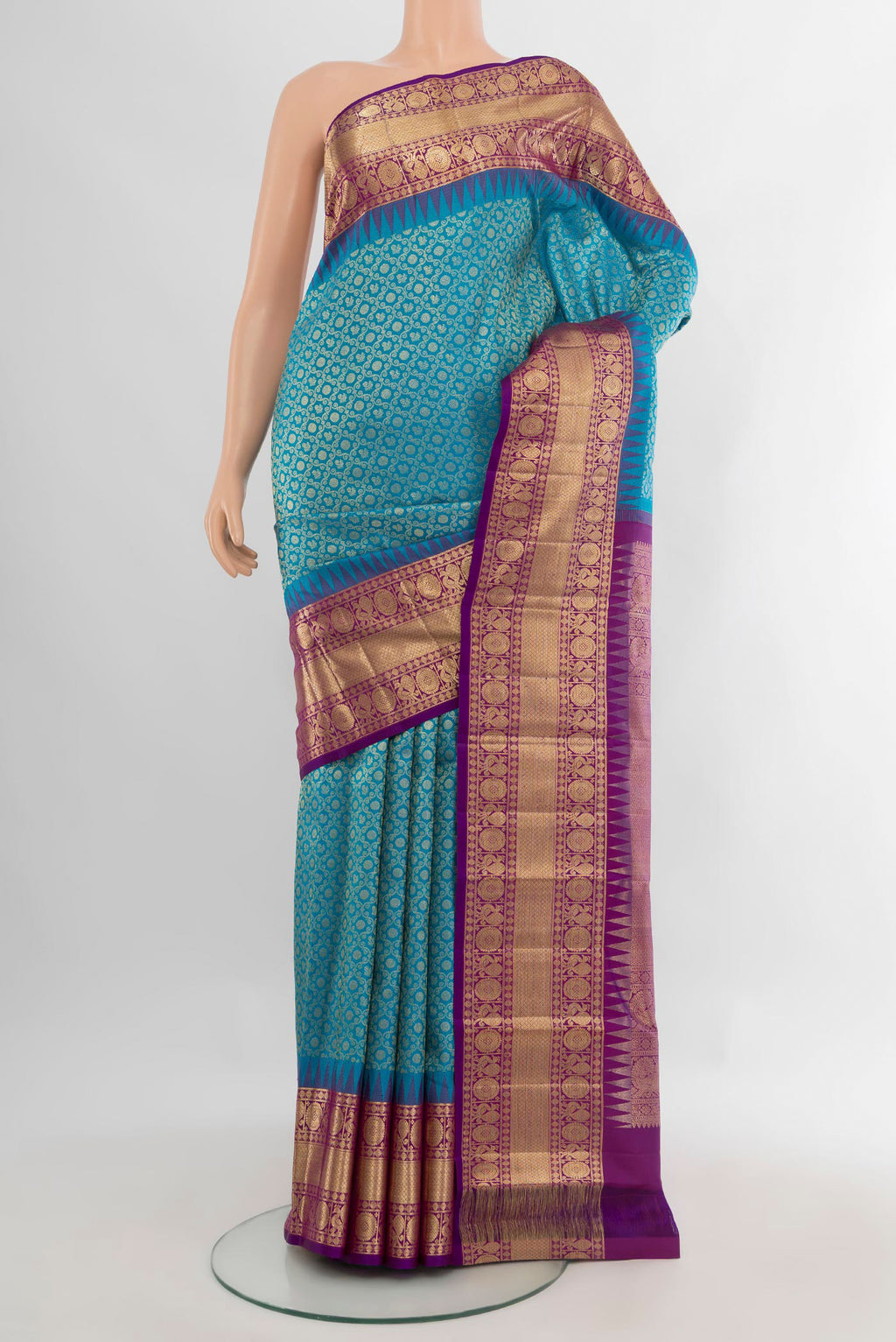 Pure Silk Blue Kanchipuram Saree with Zari Brocade on the body and Zari Border.  displayed on a mannequin