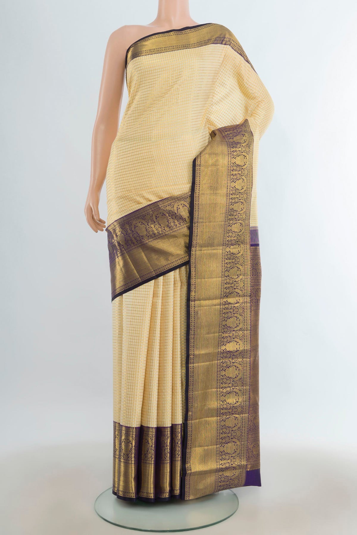 Pure Silk Golden Kanchipuram Saree with Checked design on the body and Silk Border.  displayed on a mannequin
