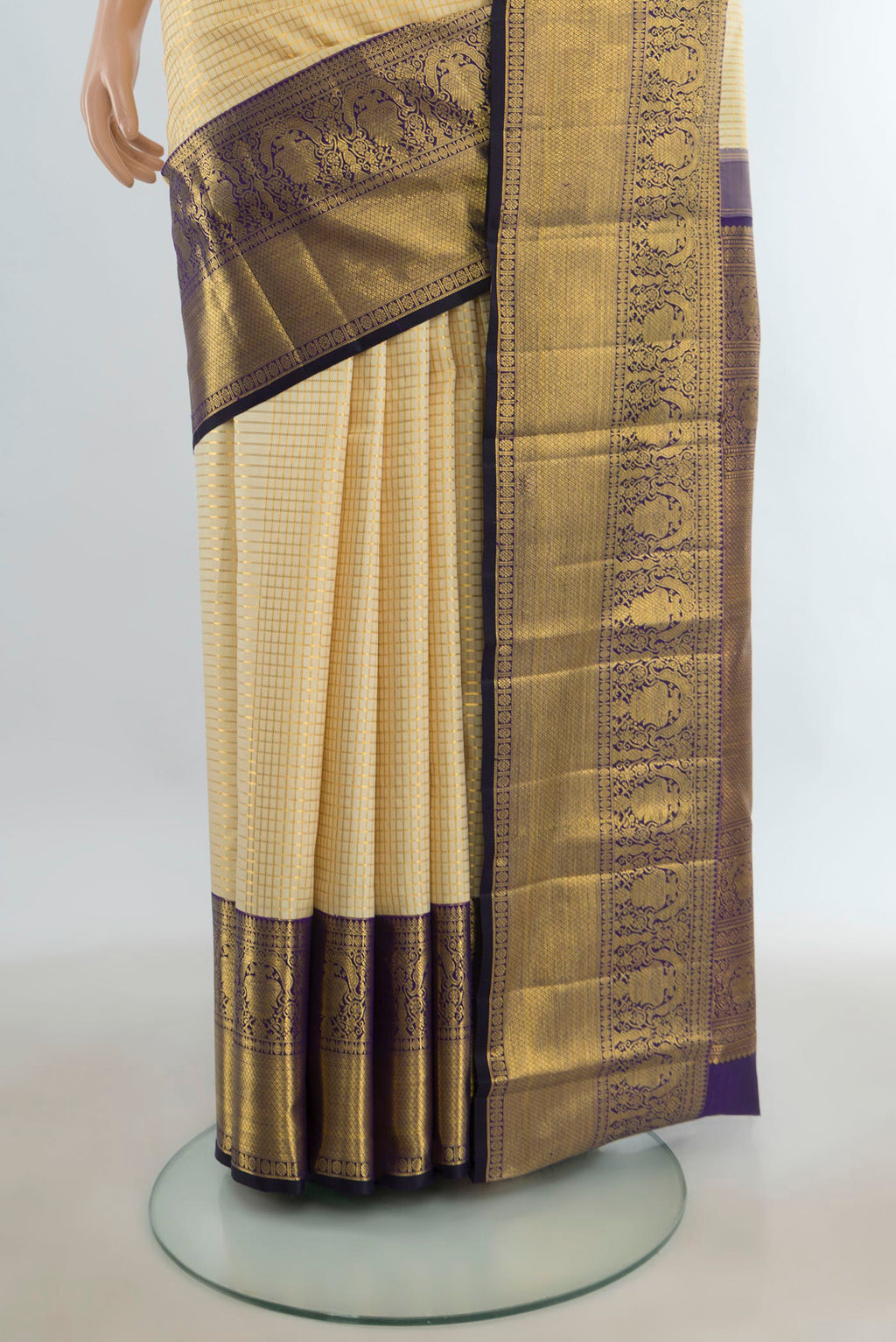 Pleats and pallu of Pure Silk Golden Kanchipuram Saree with Checked design on the body and Silk Border. 