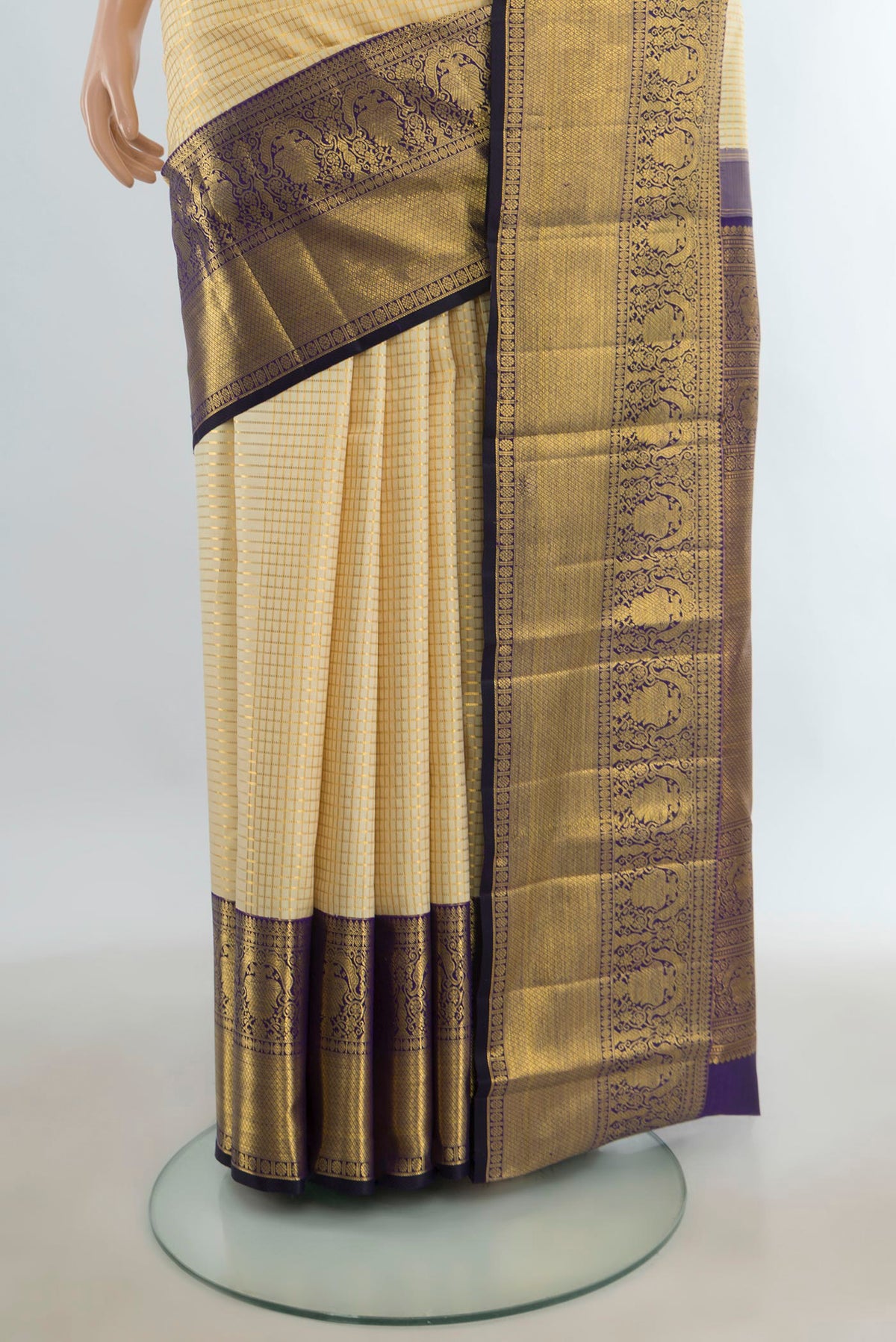 Pleats and pallu of Pure Silk Golden Kanchipuram Saree with Checked design on the body and Silk Border. 