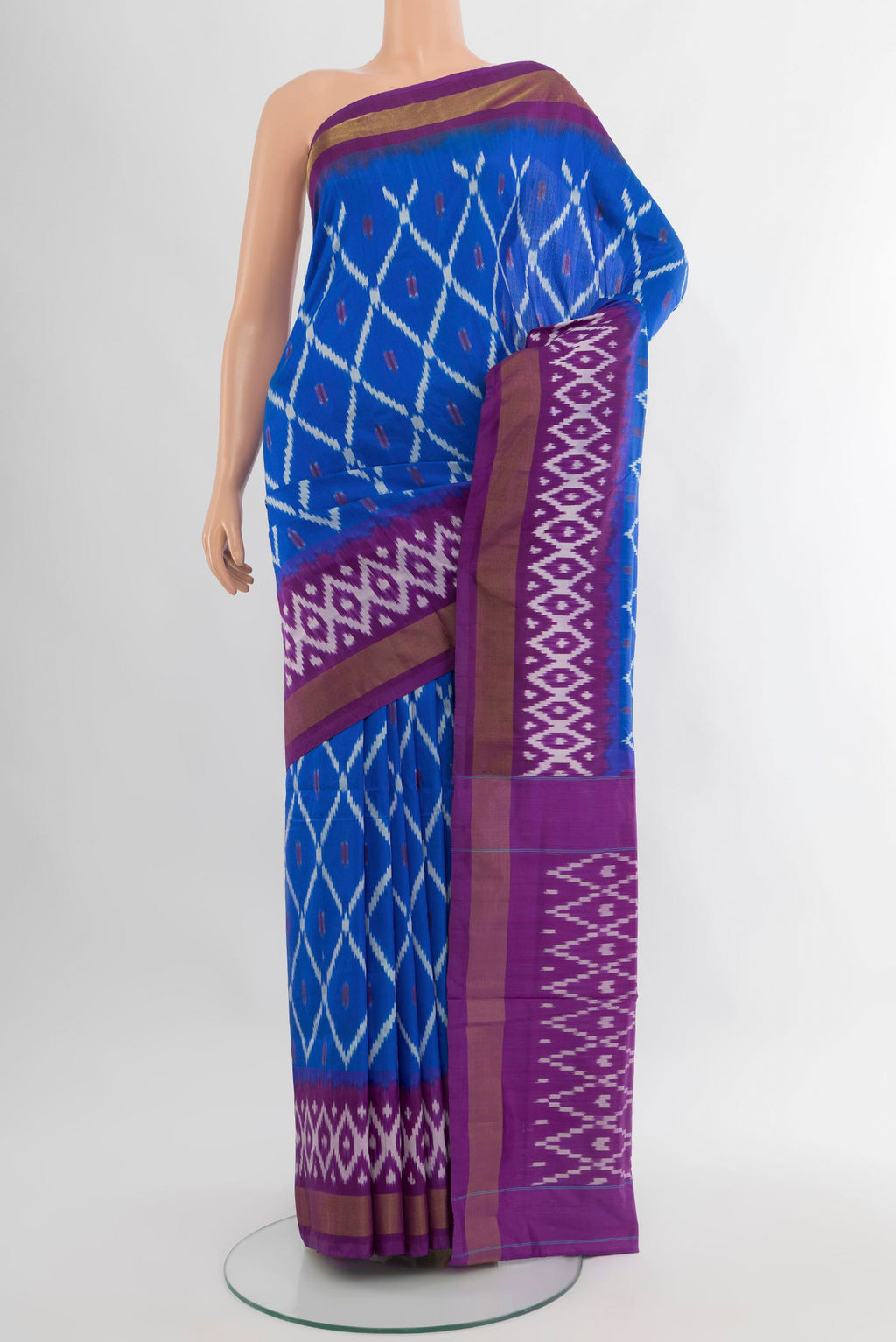 Royal Blue Pochampally Silk Saree with Ikat design on the body and Ikat Border.  displayed on a mannequin