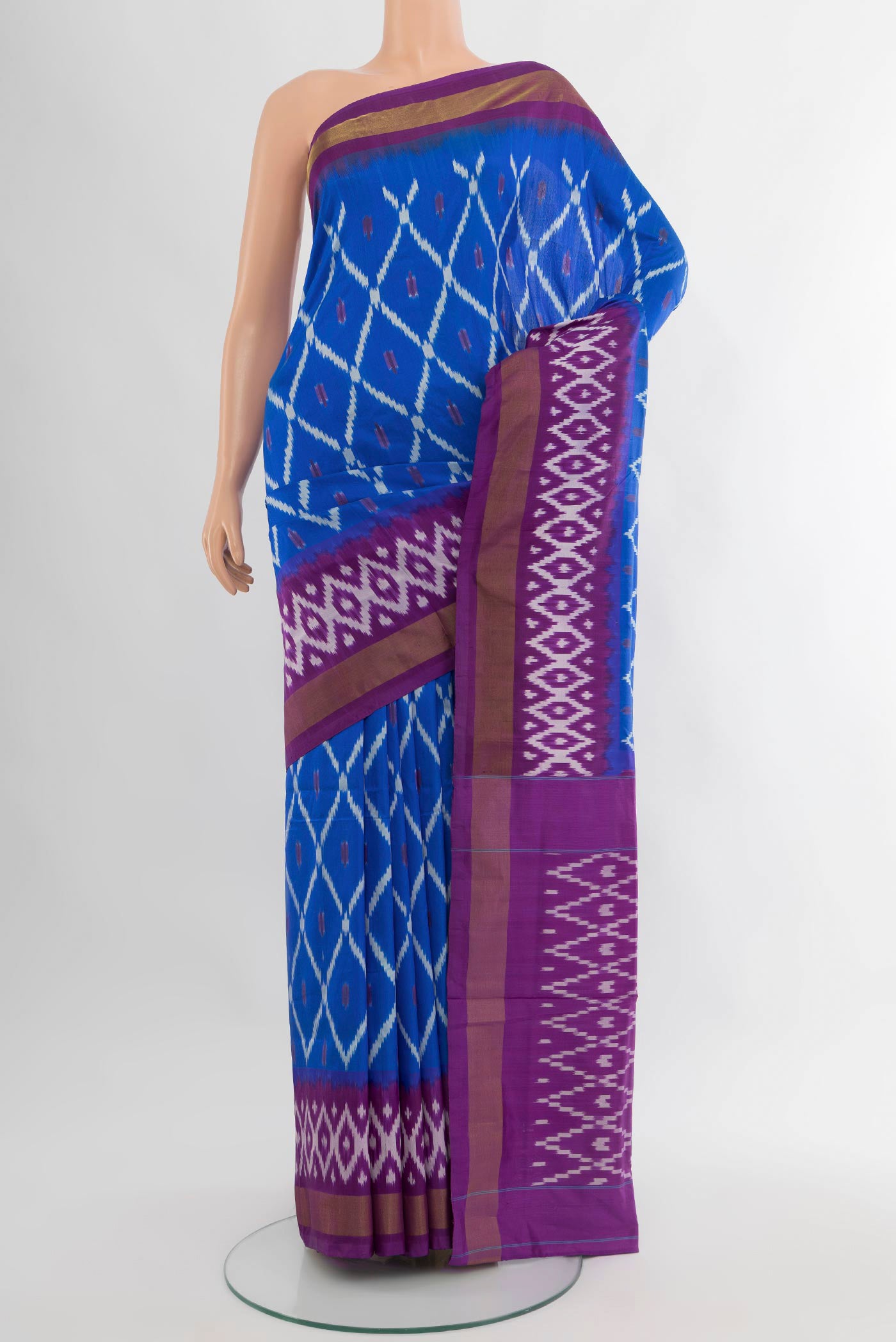 Royal Blue Pochampally Silk Saree with Ikat design on the body and Ikat Border.  displayed on a mannequin
