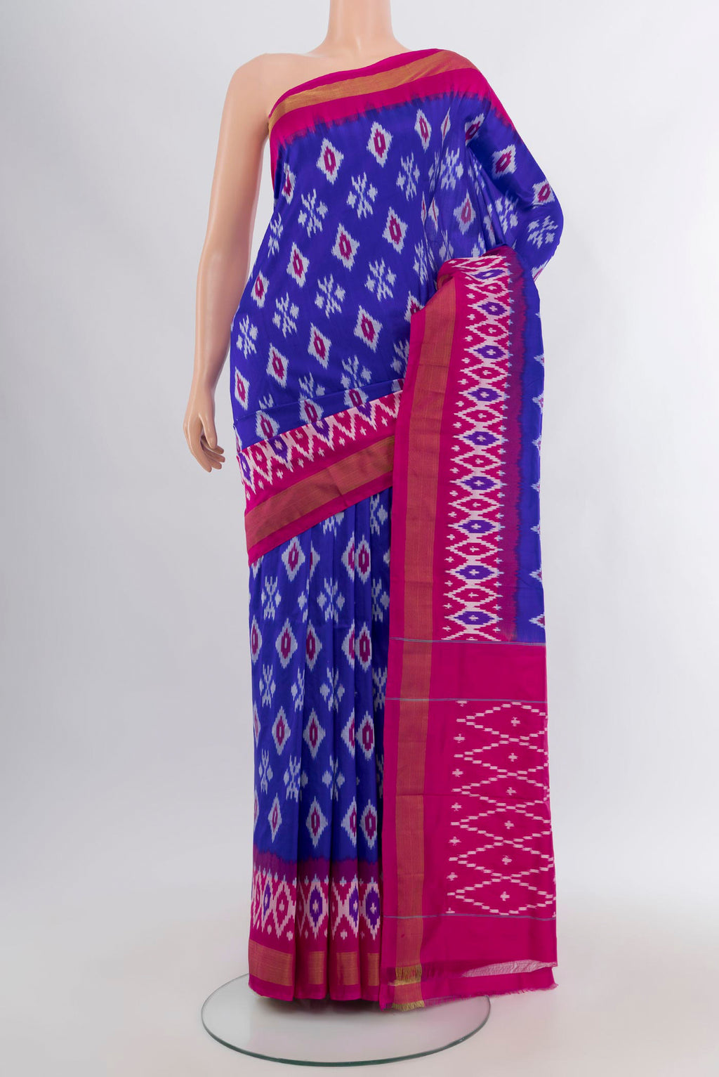 Royal Blue Pochampally Silk Saree with Ikat design on the body and Ikat Border.  displayed on a mannequin