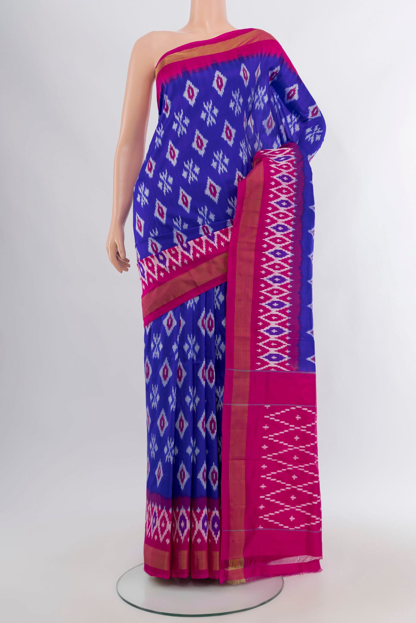 Royal Blue Pochampally Silk Saree with Ikat design on the body and Ikat Border.  displayed on a mannequin