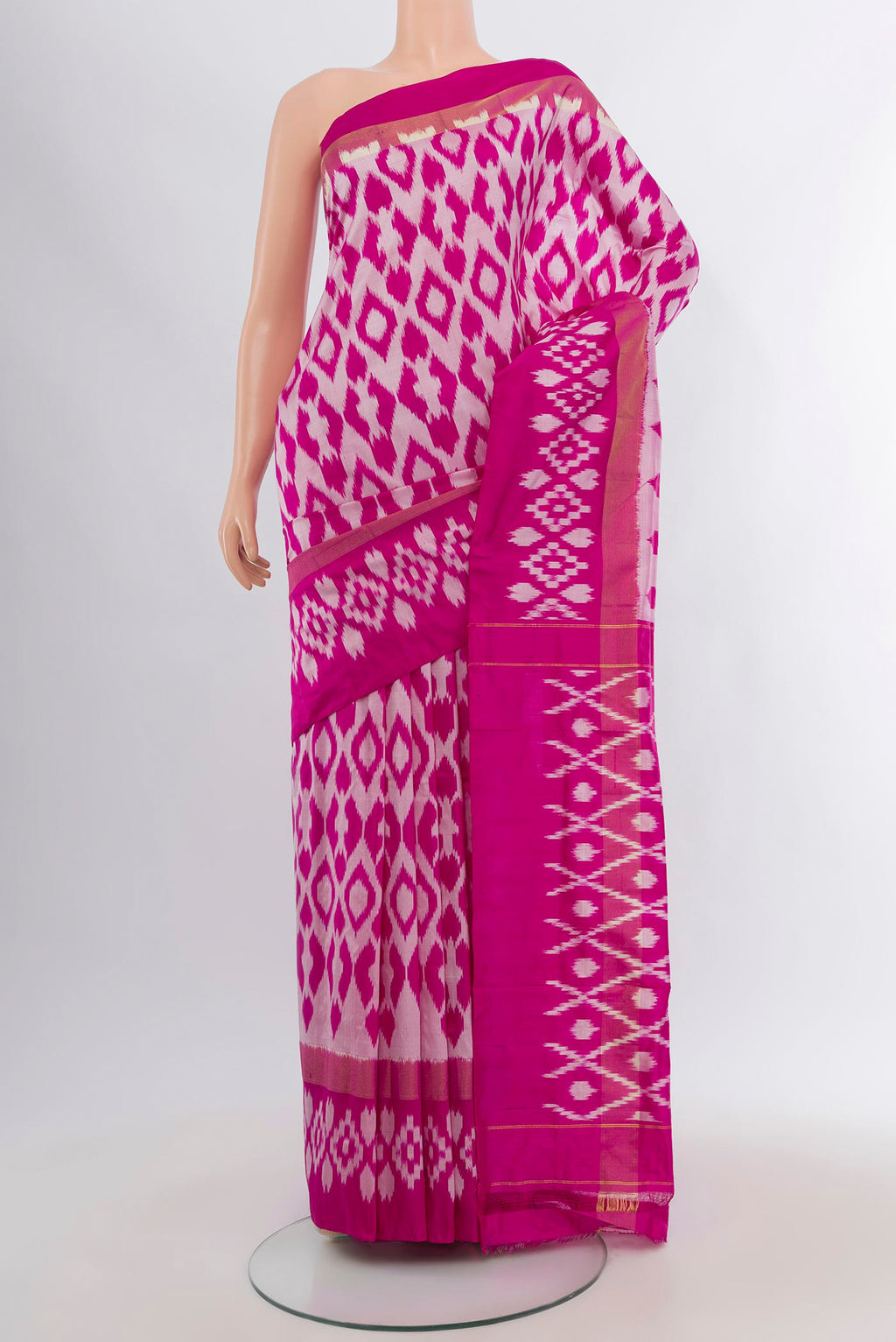 Magenta Pochampally Silk Saree with Ikat design on the body and Plain Border.  displayed on a mannequin