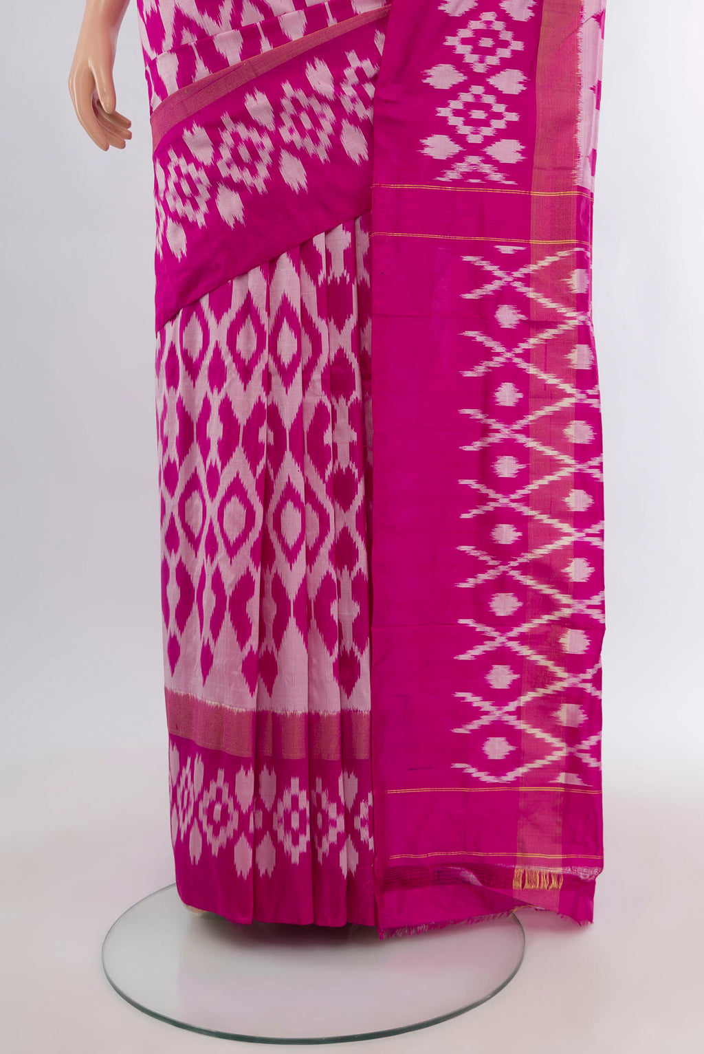 Pleats and pallu of Magenta Pochampally Silk Saree with Ikat design on the body and Plain Border. 