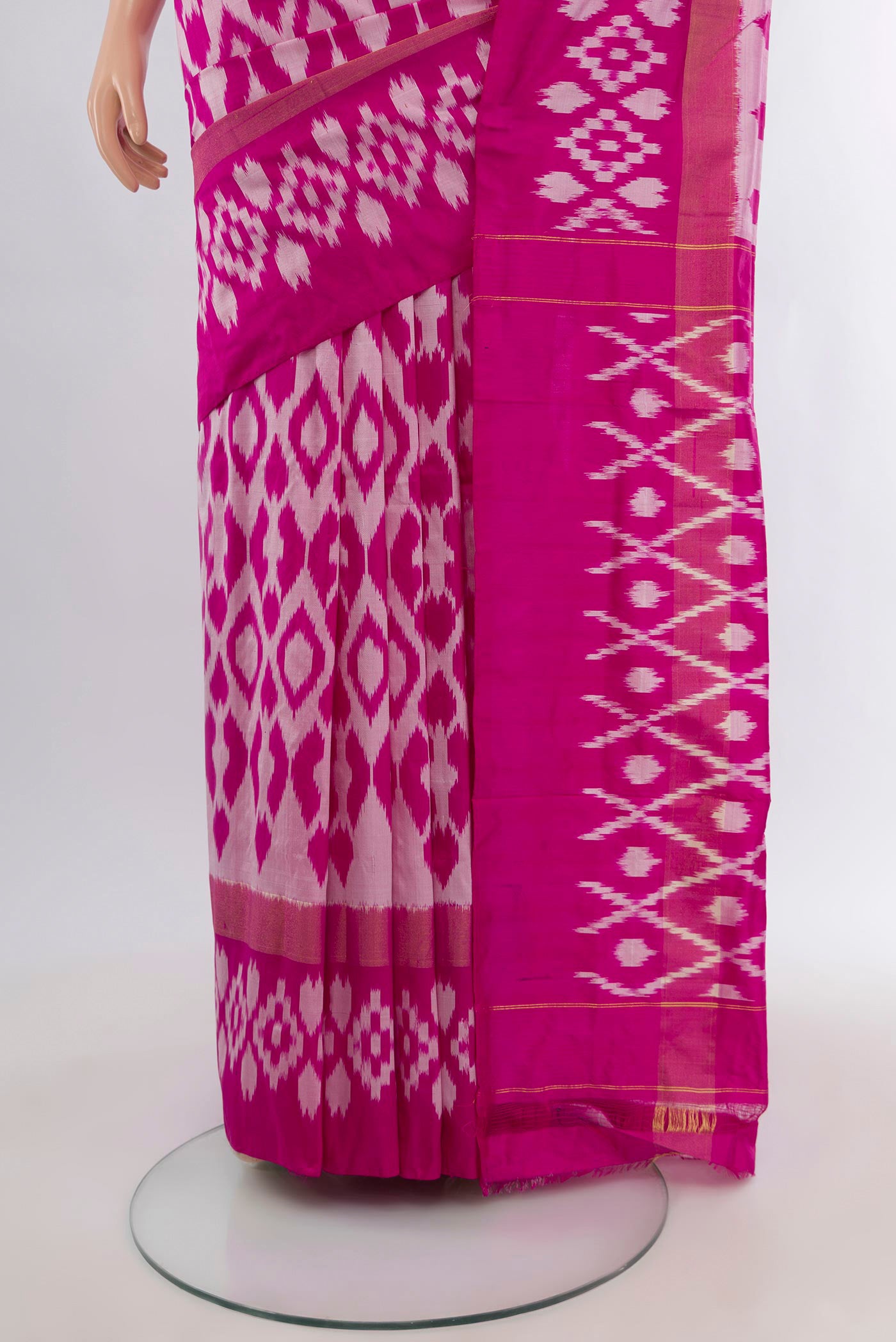 Pleats and pallu of Magenta Pochampally Silk Saree with Ikat design on the body and Plain Border. 