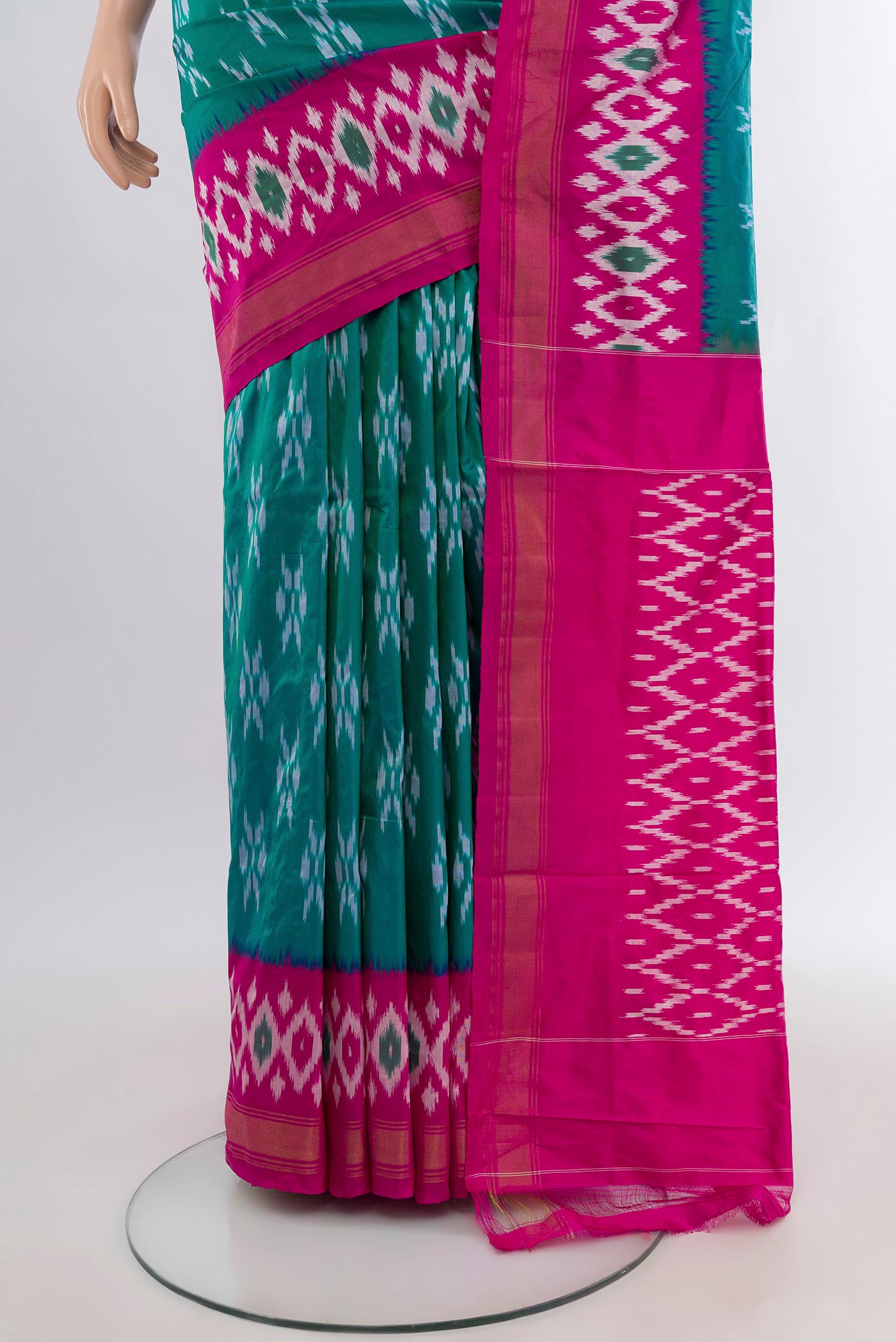 Pleats and pallu of Teal Pochampally Silk Saree with Ikat design on the body and Ikat Border. 