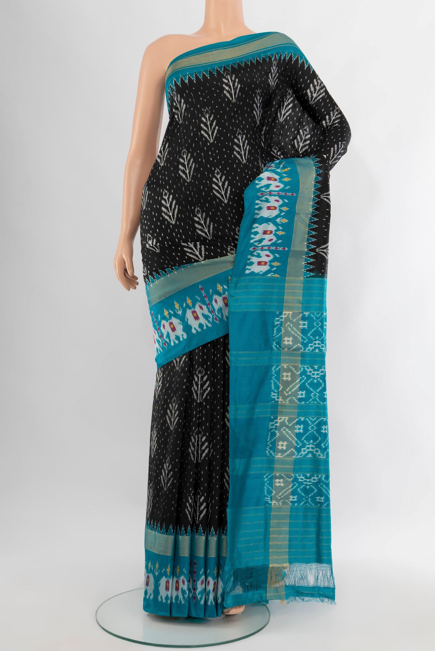 Black Pochampally Silk Saree with Pure Ikat on the body and Zari Border.  displayed on a mannequin
