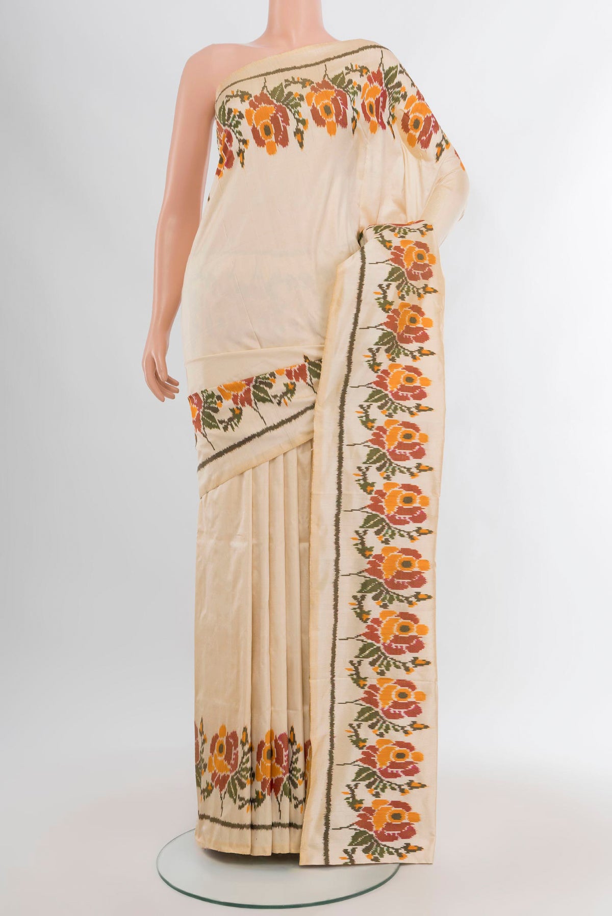 Cream Pochampally Silk Saree with Plain Body and Fancy Border.  displayed on a mannequin