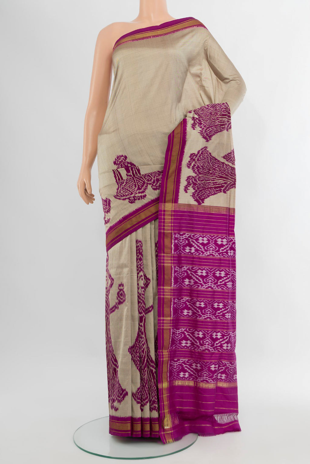 Grey Pochampally Silk Saree with Pure Ikat on the body and Ikat Border.  displayed on a mannequin