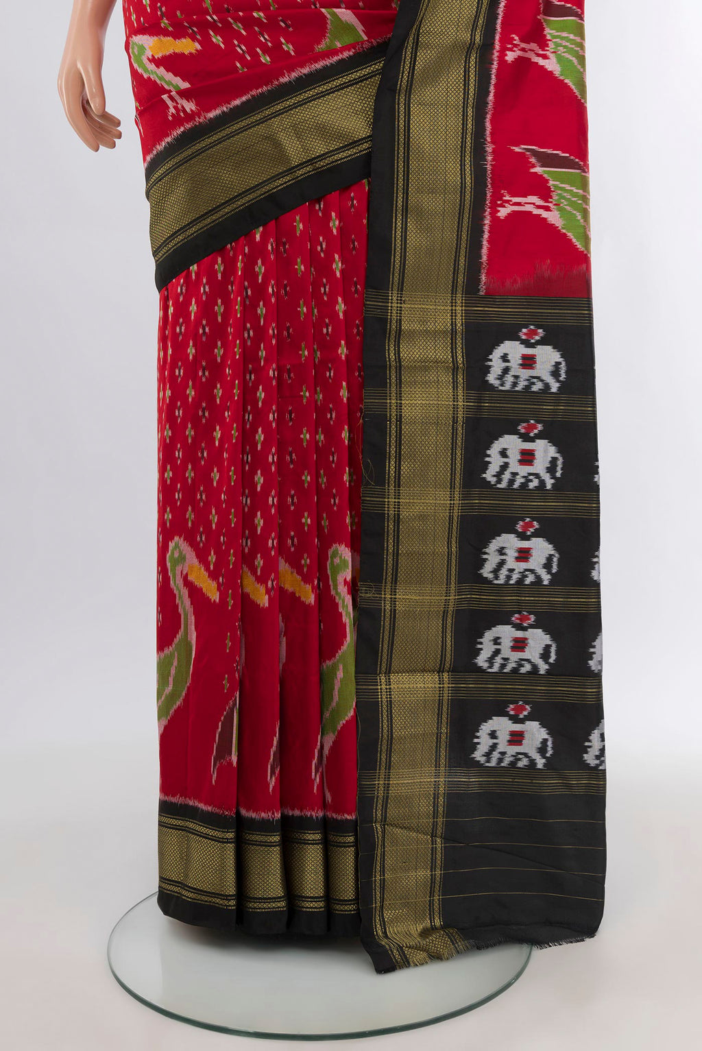Pleats and pallu of Red Pochampally Silk Saree with Ikat design on the body and Zari Border. 