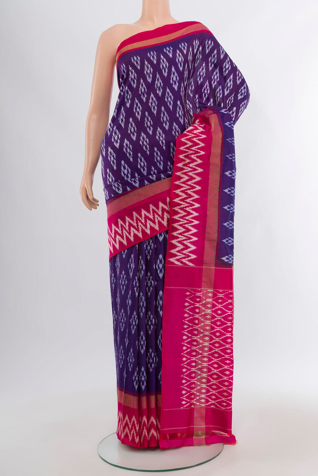 Violet Pochampally Silk Saree with Ikat design on the body and Ikat Border.  displayed on a mannequin