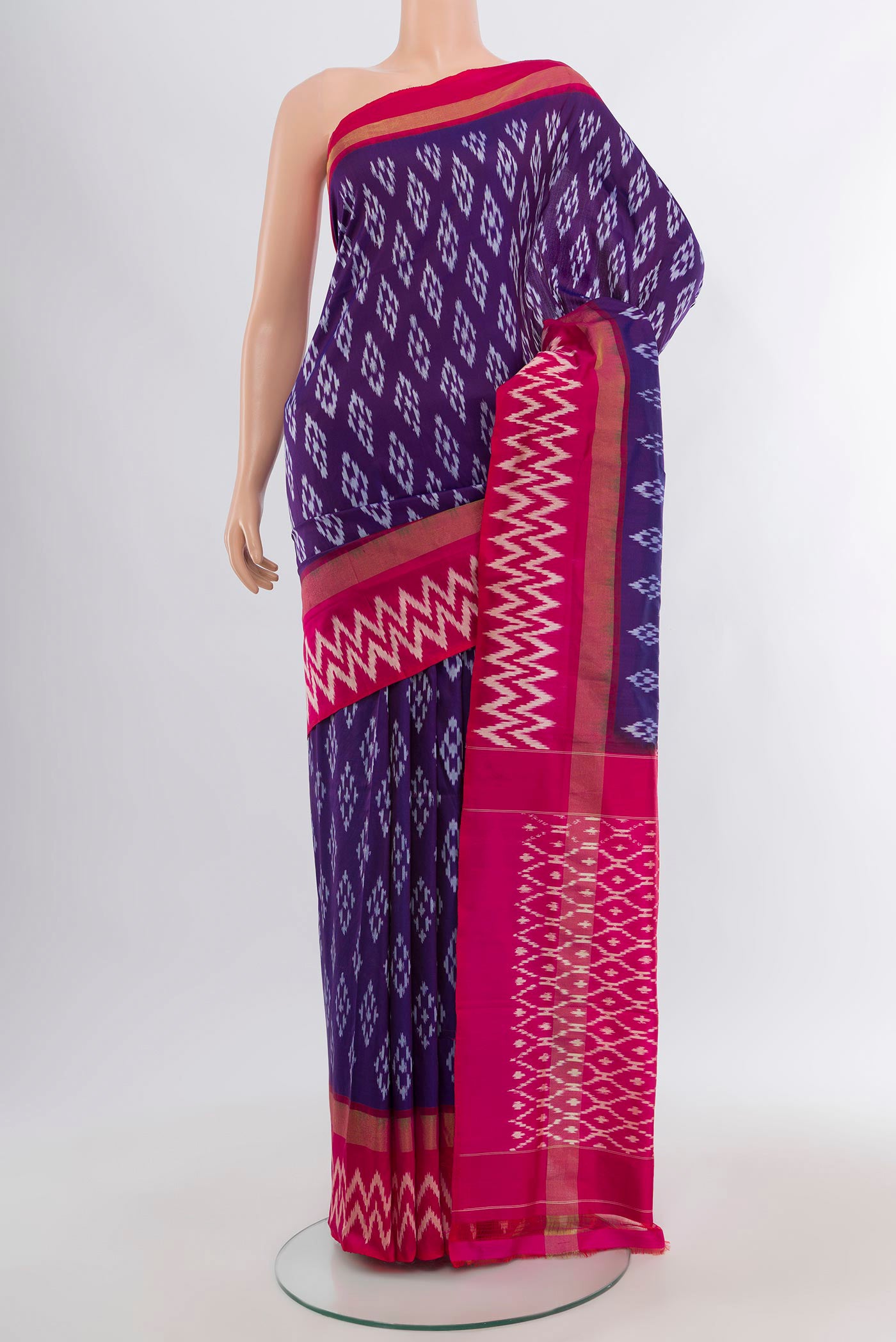 Violet Pochampally Silk Saree with Ikat design on the body and Ikat Border.  displayed on a mannequin