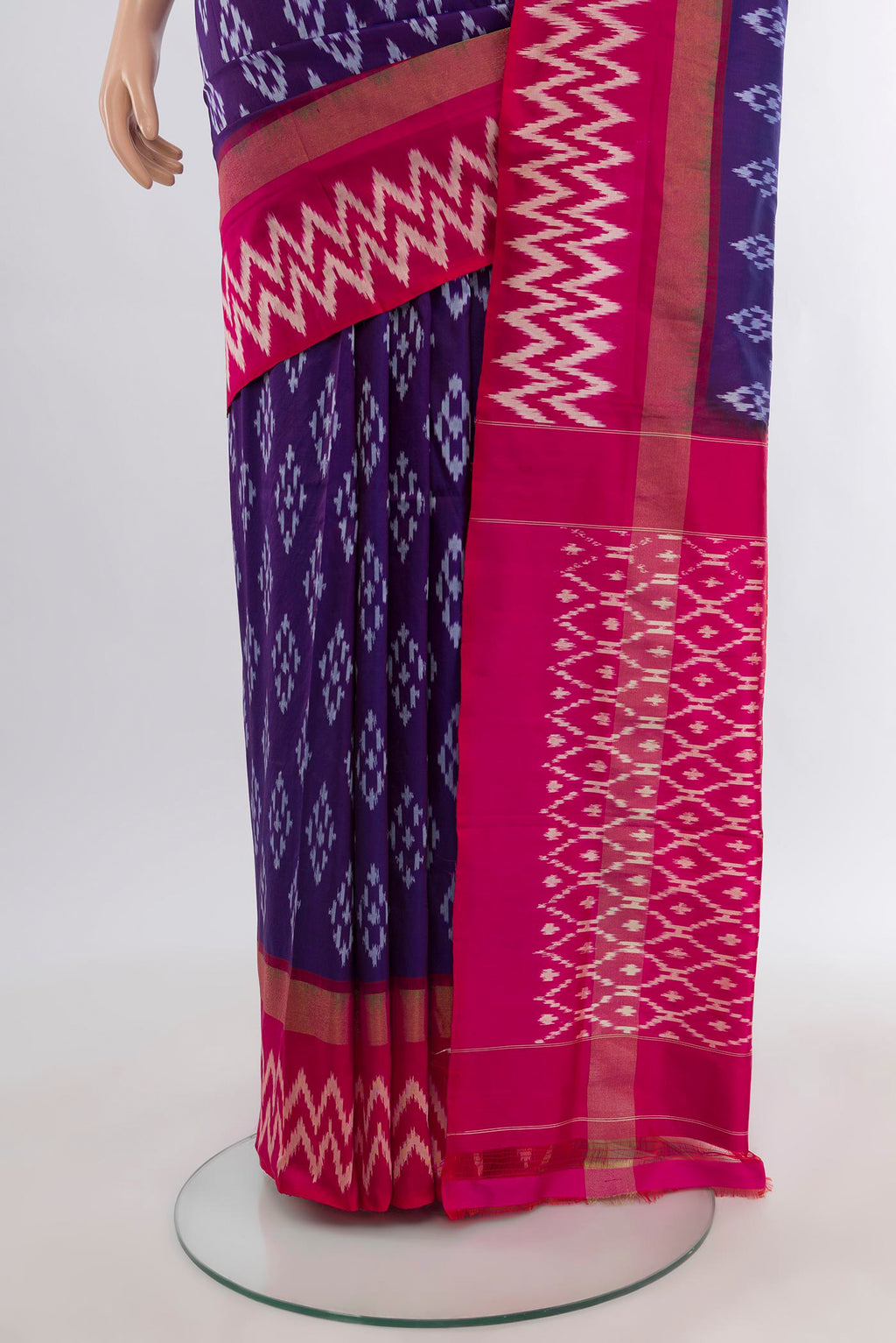 Pleats and pallu of Violet Pochampally Silk Saree with Ikat design on the body and Ikat Border. 