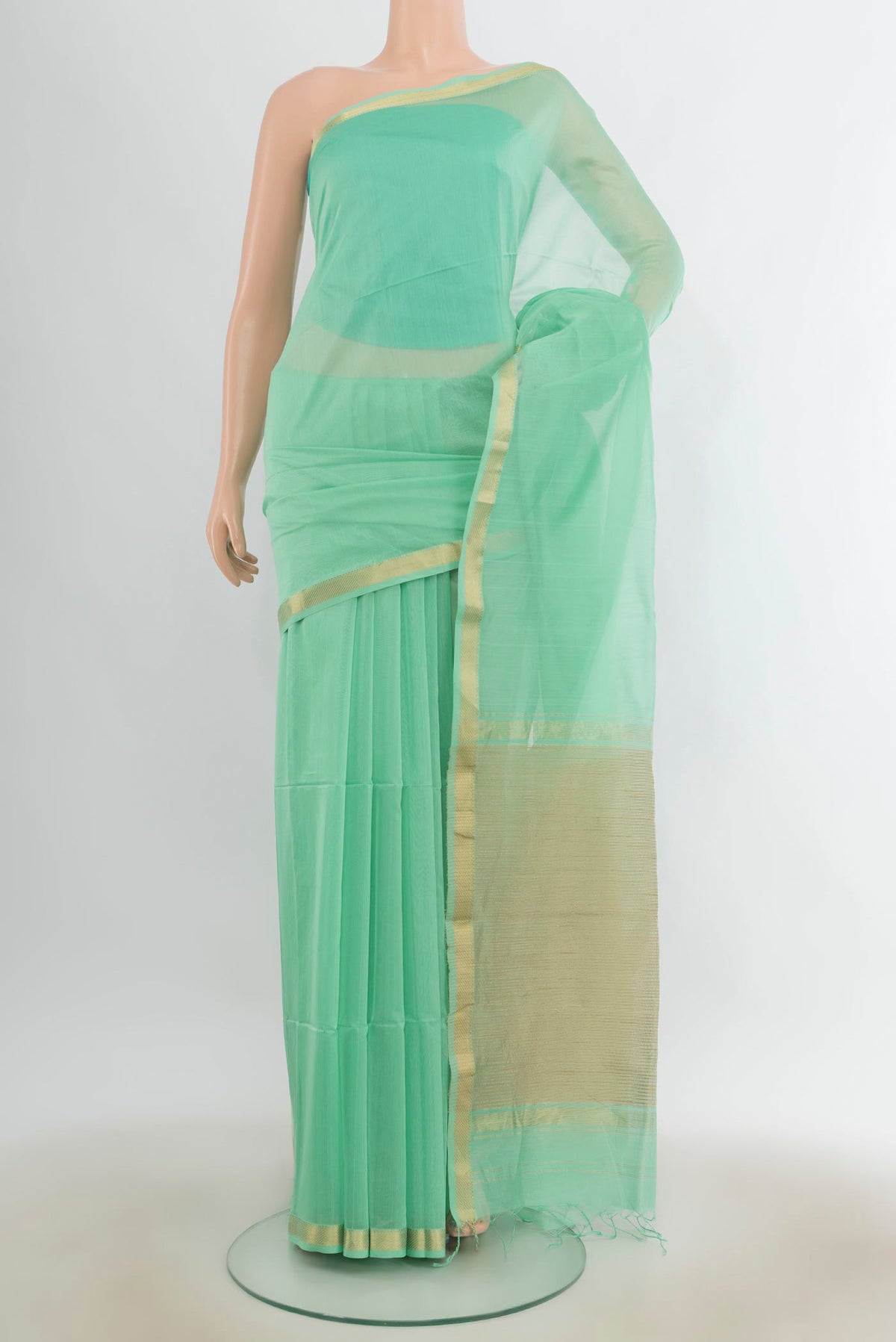Sea Green Maheshwari Cotton Saree with Plain Body and Zari Border.  displayed on a mannequin