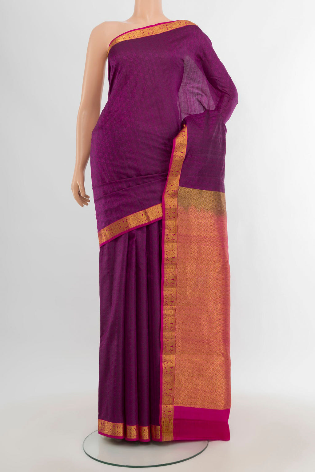 Purple Kanjivaram Silk Saree with Jacquard design on the body and Zari Border.  displayed on a mannequin