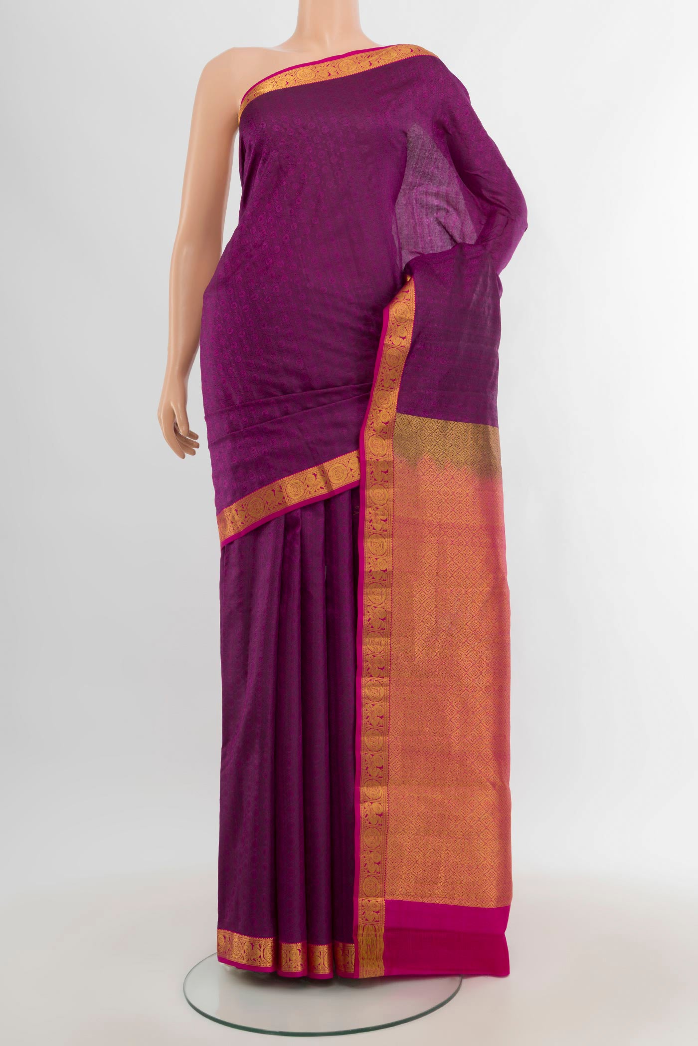 Purple Kanjivaram Silk Saree with Jacquard design on the body and Zari Border.  displayed on a mannequin