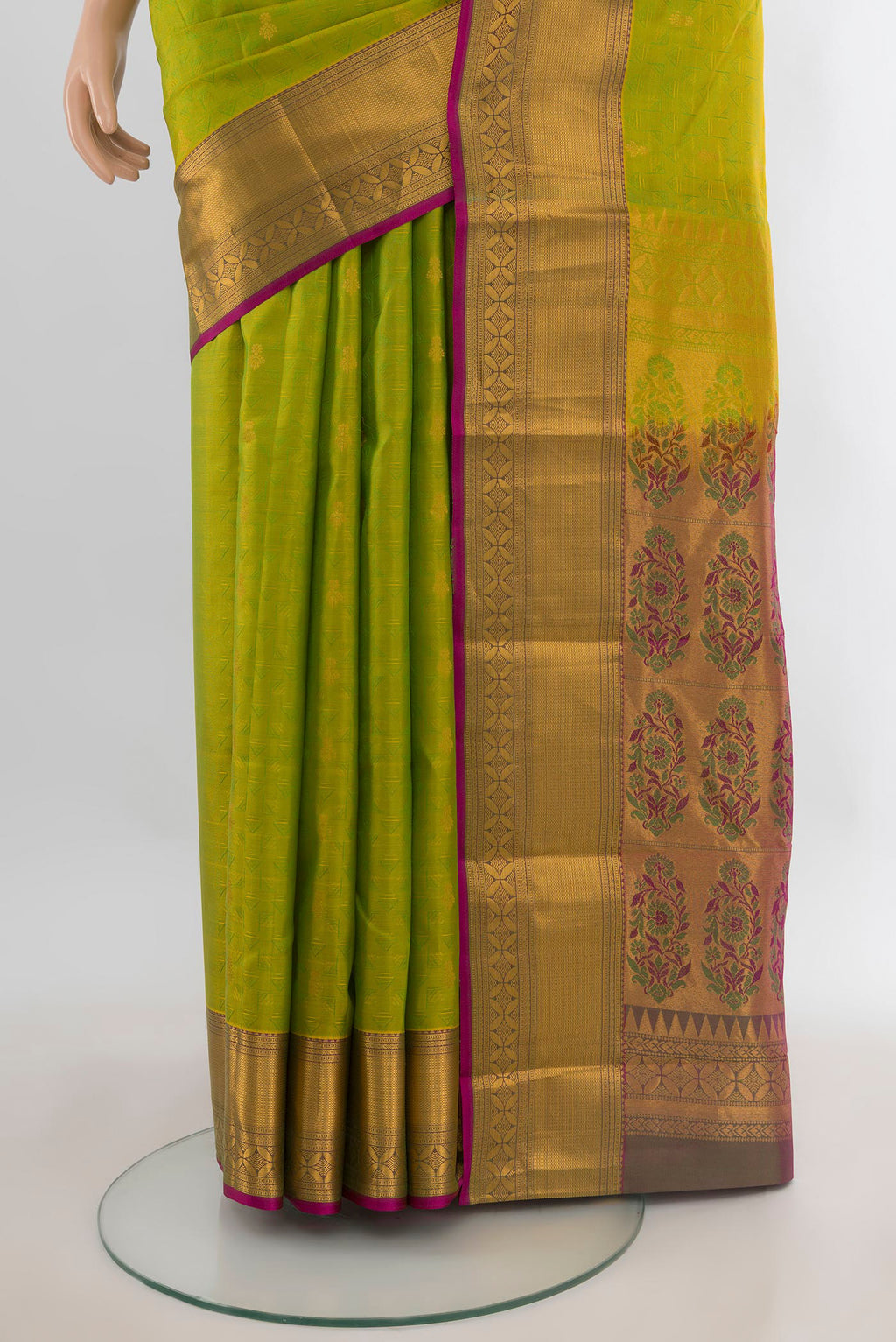 Pleats and pallu of Pure Silk Parrot Green Kanchipuram Saree with Jacquard With Zari Butta on the body and Zari Border. 