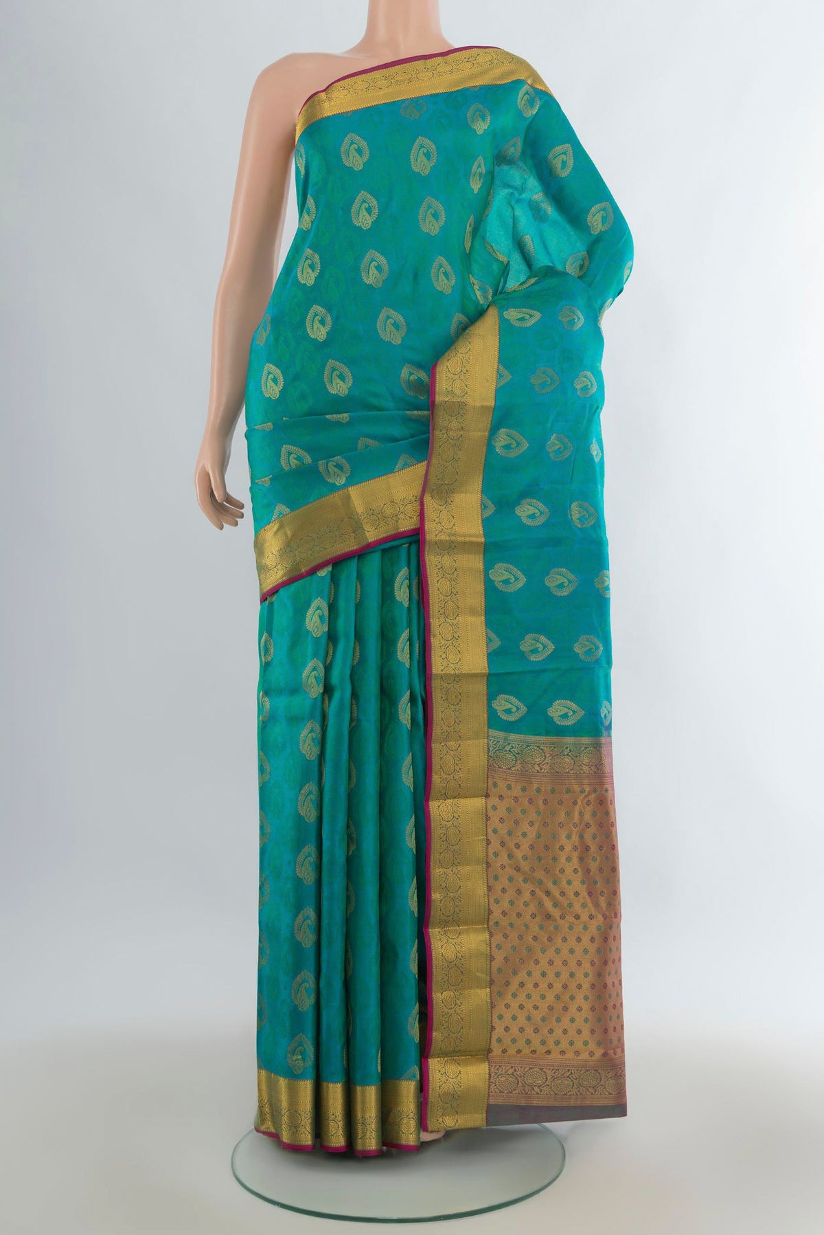 Pure Silk Turquoise Kanchipuram Saree with Jacquard With Zari Butta on the body and Zari Border.  displayed on a mannequin