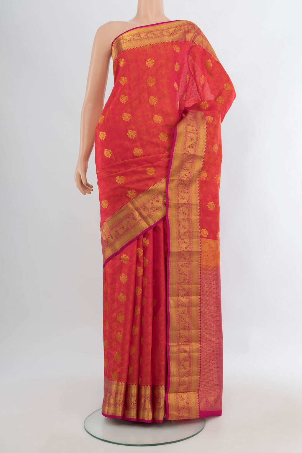 Pinkish Yellow Kanchipuram Silk Saree with Jacquard With Zari Butta on the body and Zari Border.  displayed on a mannequin