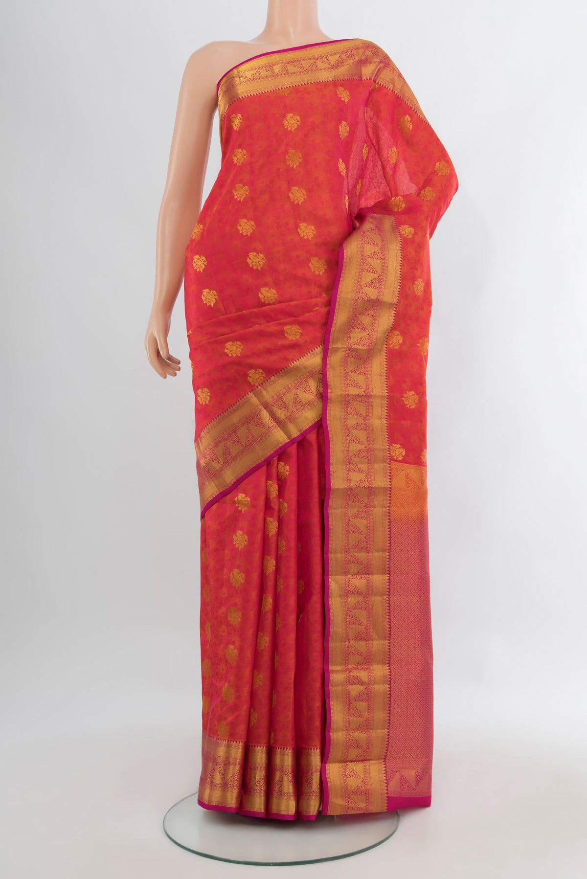 Pinkish Yellow Kanchipuram Silk Saree with Jacquard With Zari Butta on the body and Zari Border.  displayed on a mannequin