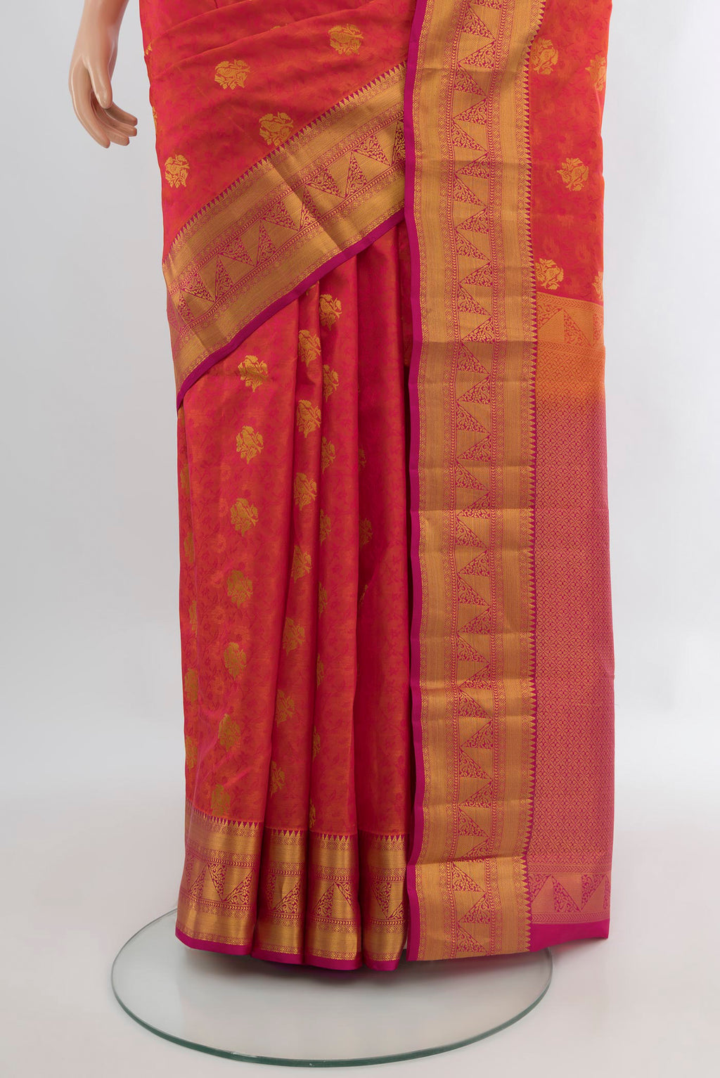 Pleats and pallu of Pinkish Yellow Kanchipuram Silk Saree with Jacquard With Zari Butta on the body and Zari Border. 