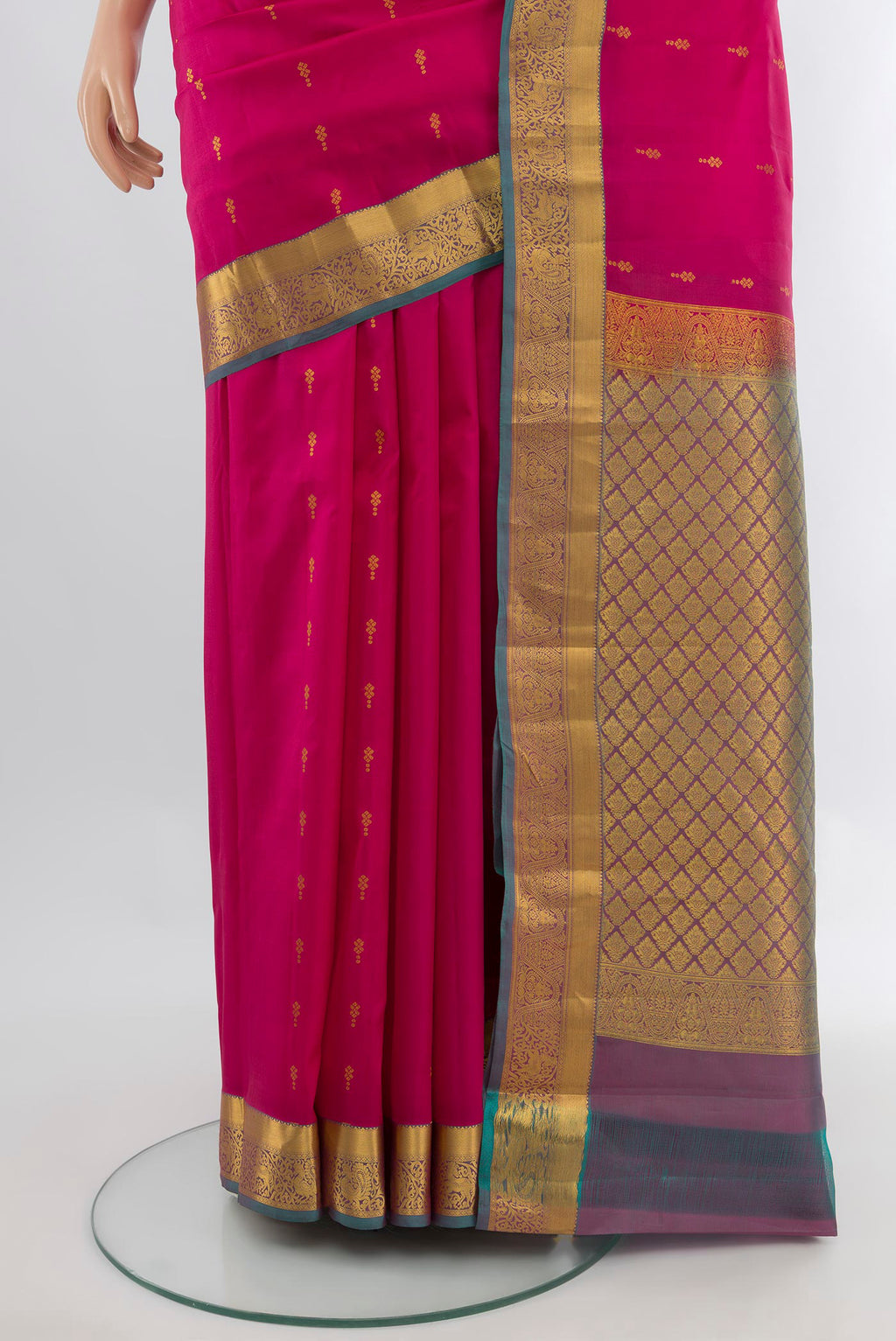 Pleats and pallu of Dark Pink Kanjivaram Silk Saree with Zari Butta on the body and Zari Border. 