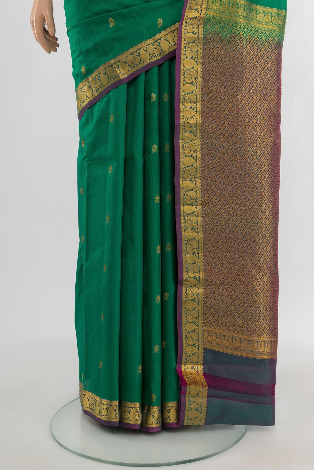 Pleats and pallu of Green Kanjivaram Silk Saree with Zari Butta on the body and Zari Border. 