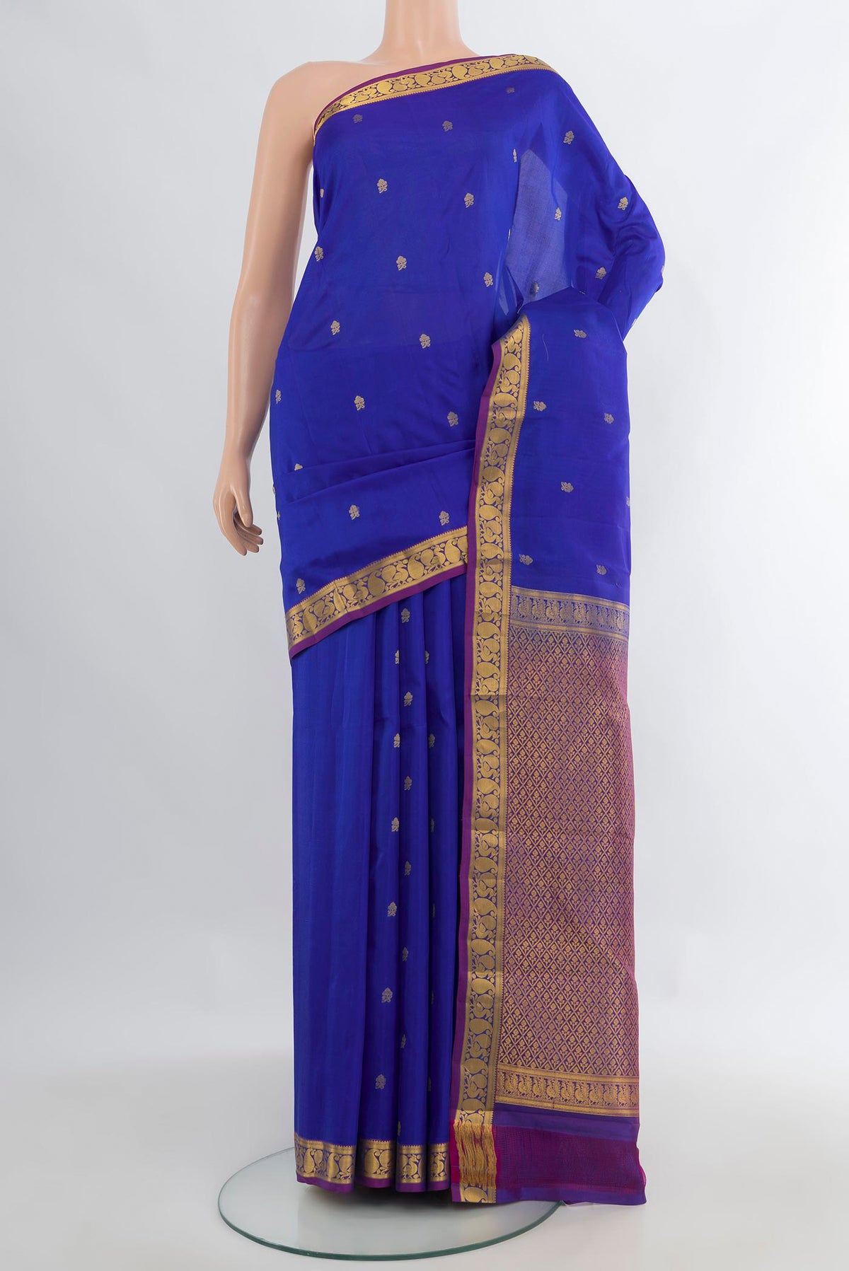 Pure Silk Royal Blue Kanjivaram Saree with Zari Butta on the body and Zari Border.  displayed on a mannequin
