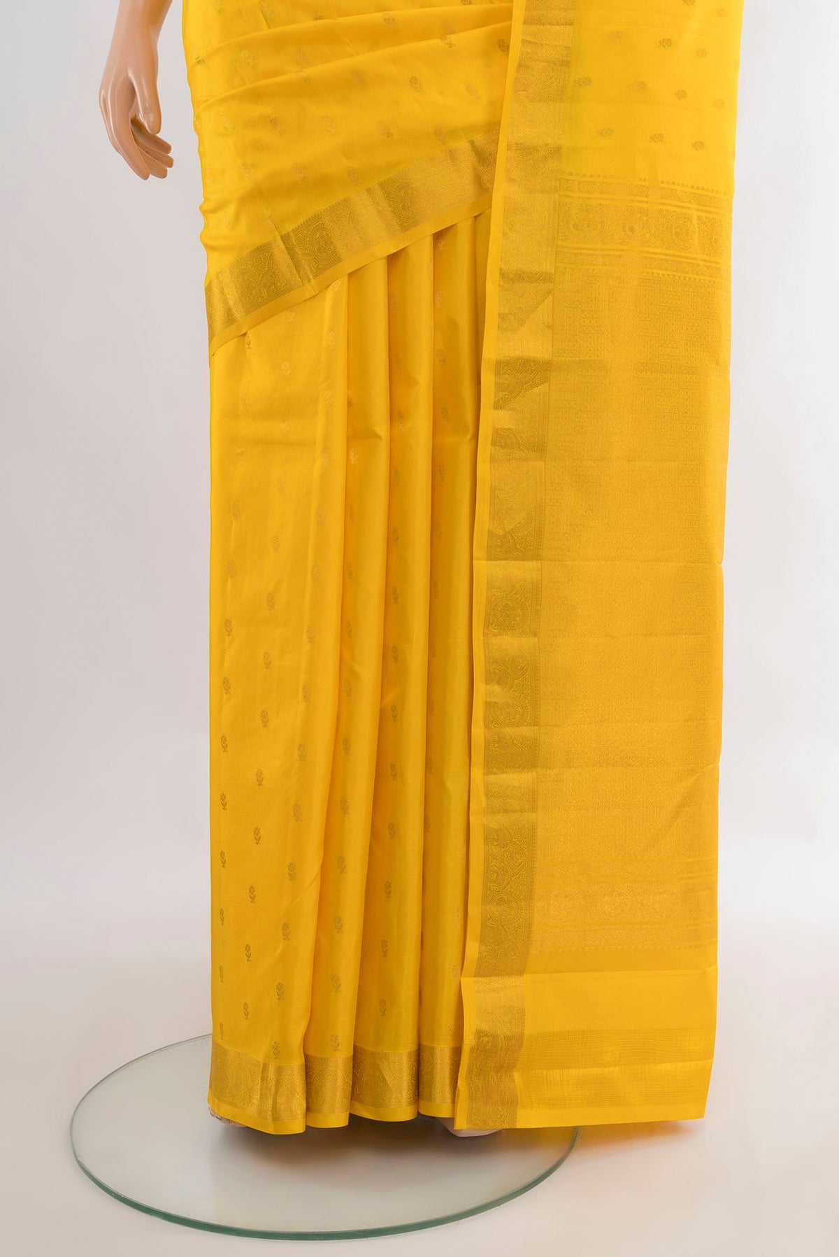 Pleats and pallu of Pure Silk Yellow Kanchipuram Saree with Zari Butta on the body and Zari Border. 