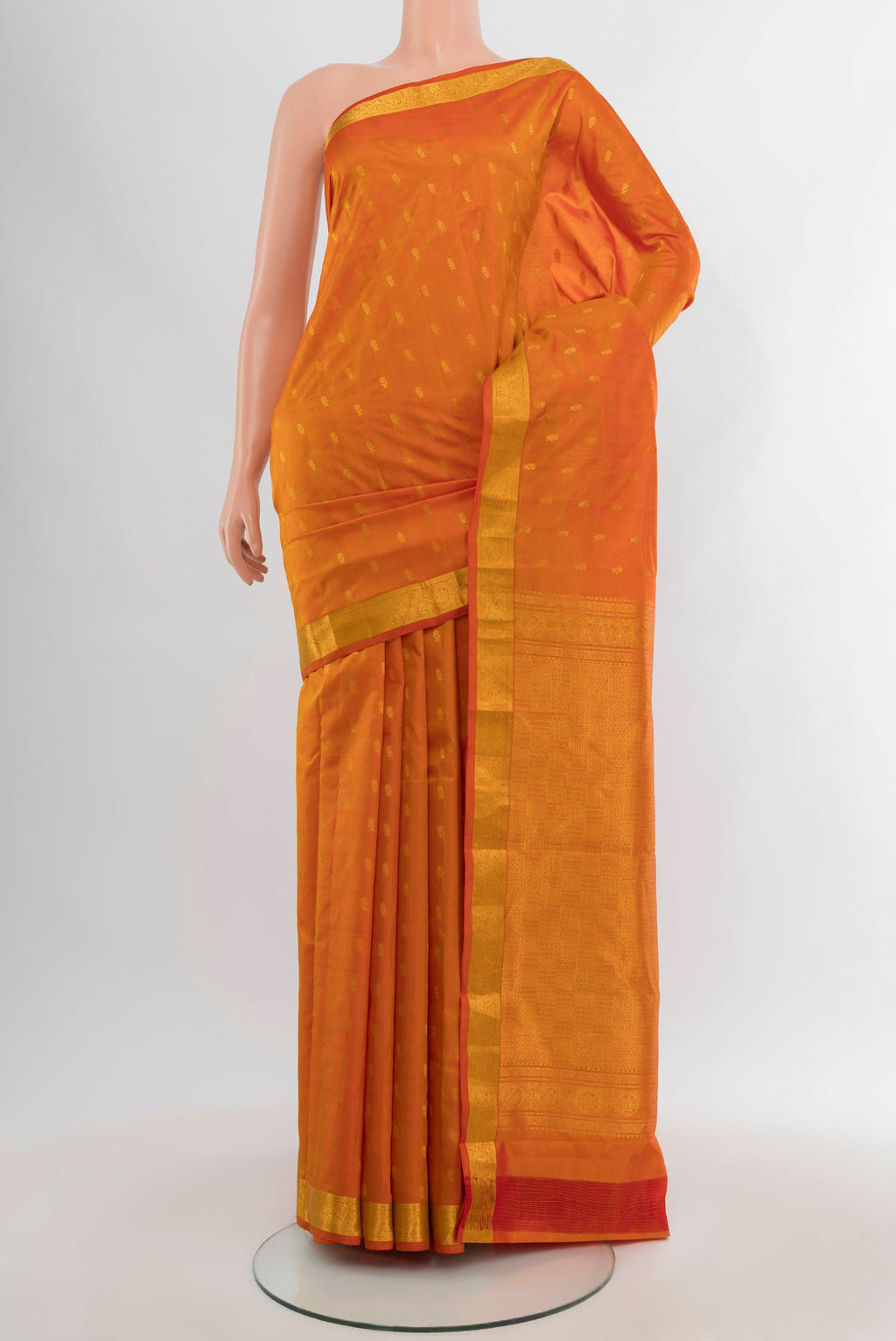 Yellow Kanchipuram Silk Saree with Zari Butta on the body and Zari Border.  displayed on a mannequin