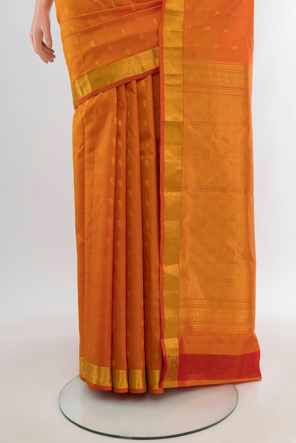 Pleats and pallu of Yellow Kanchipuram Silk Saree with Zari Butta on the body and Zari Border. 