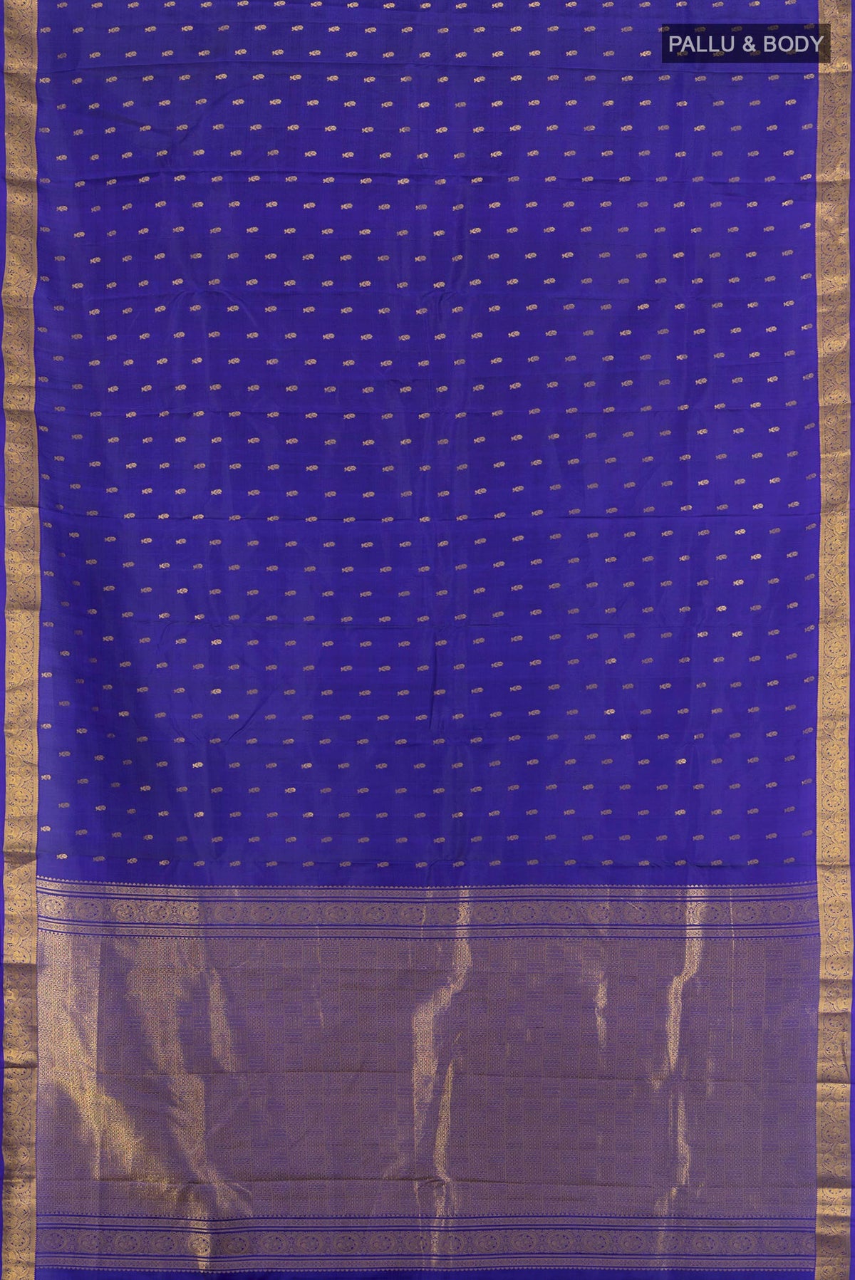 Flat view of Pure Silk Dark Blue Kanchipuram Saree with Zari Butta on the body and Zari Border. 