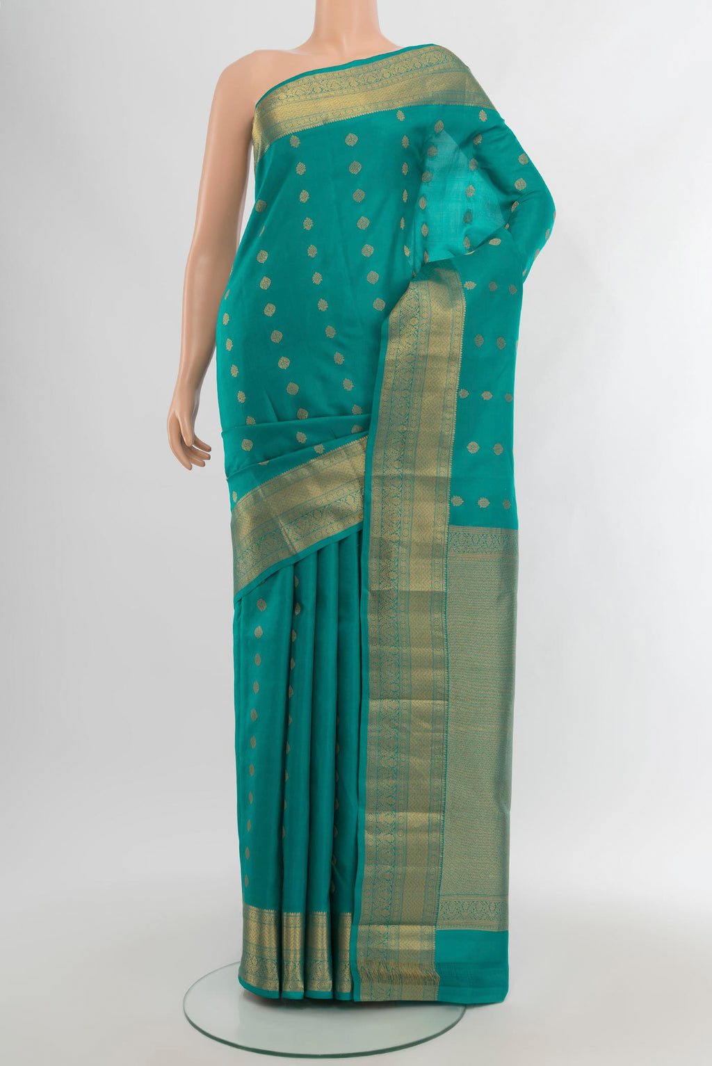 Light Blue Kanchipuram Silk Saree with Zari Butta on the body and Zari Border.  displayed on a mannequin