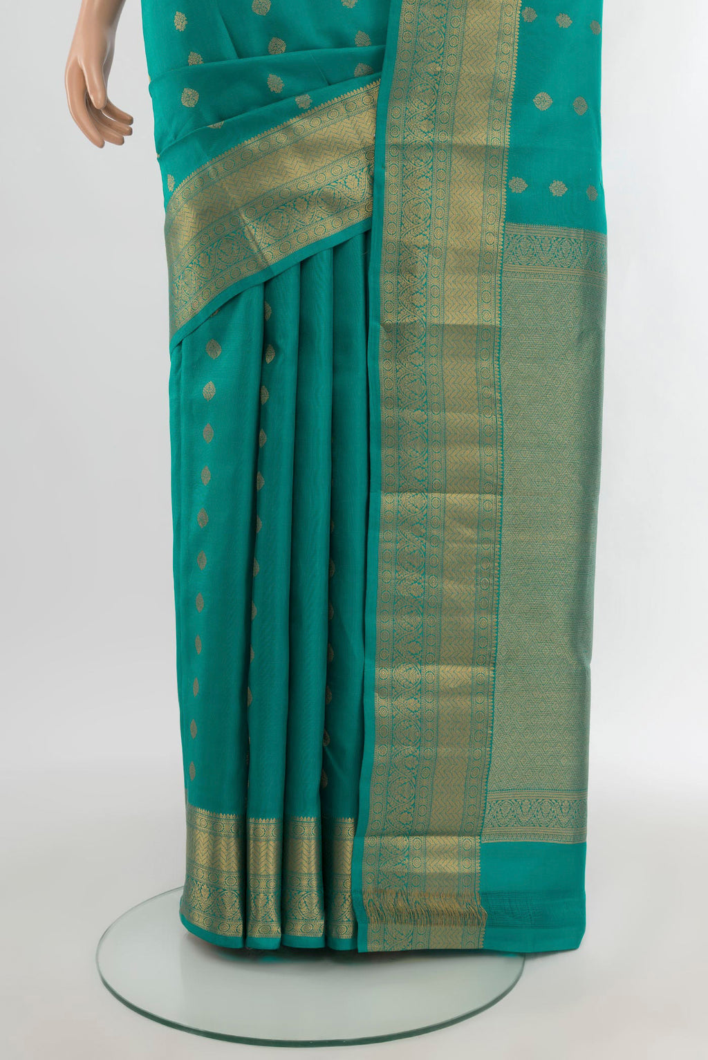Pleats and pallu of Light Blue Kanchipuram Silk Saree with Zari Butta on the body and Zari Border. 