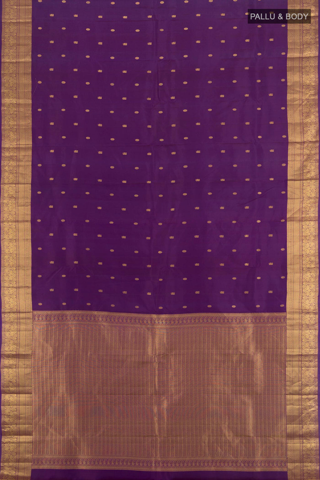 Flat view of Violet Kanchipuram Silk Saree with Zari Butta on the body and Zari Border. 