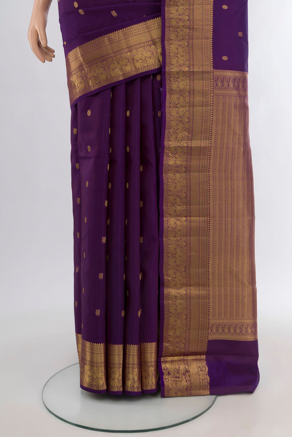Pleats and pallu of Violet Kanchipuram Silk Saree with Zari Butta on the body and Zari Border. 