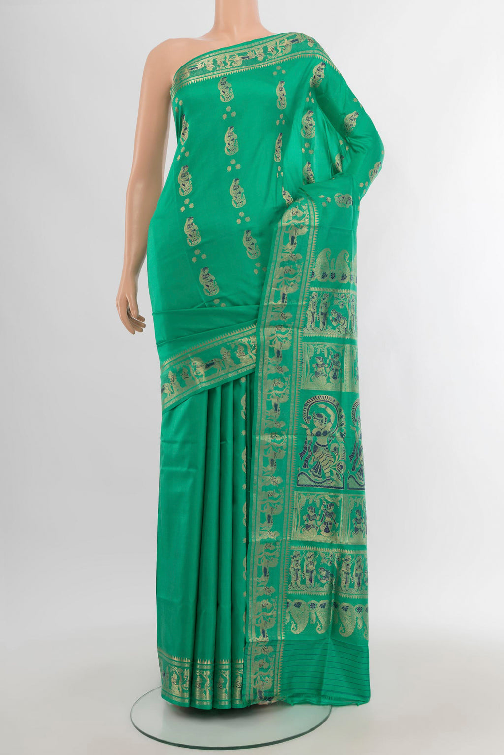 Sea Green Baluchari Silk Saree with Zari And Thread Butta on the body and Zari Border.  displayed on a mannequin
