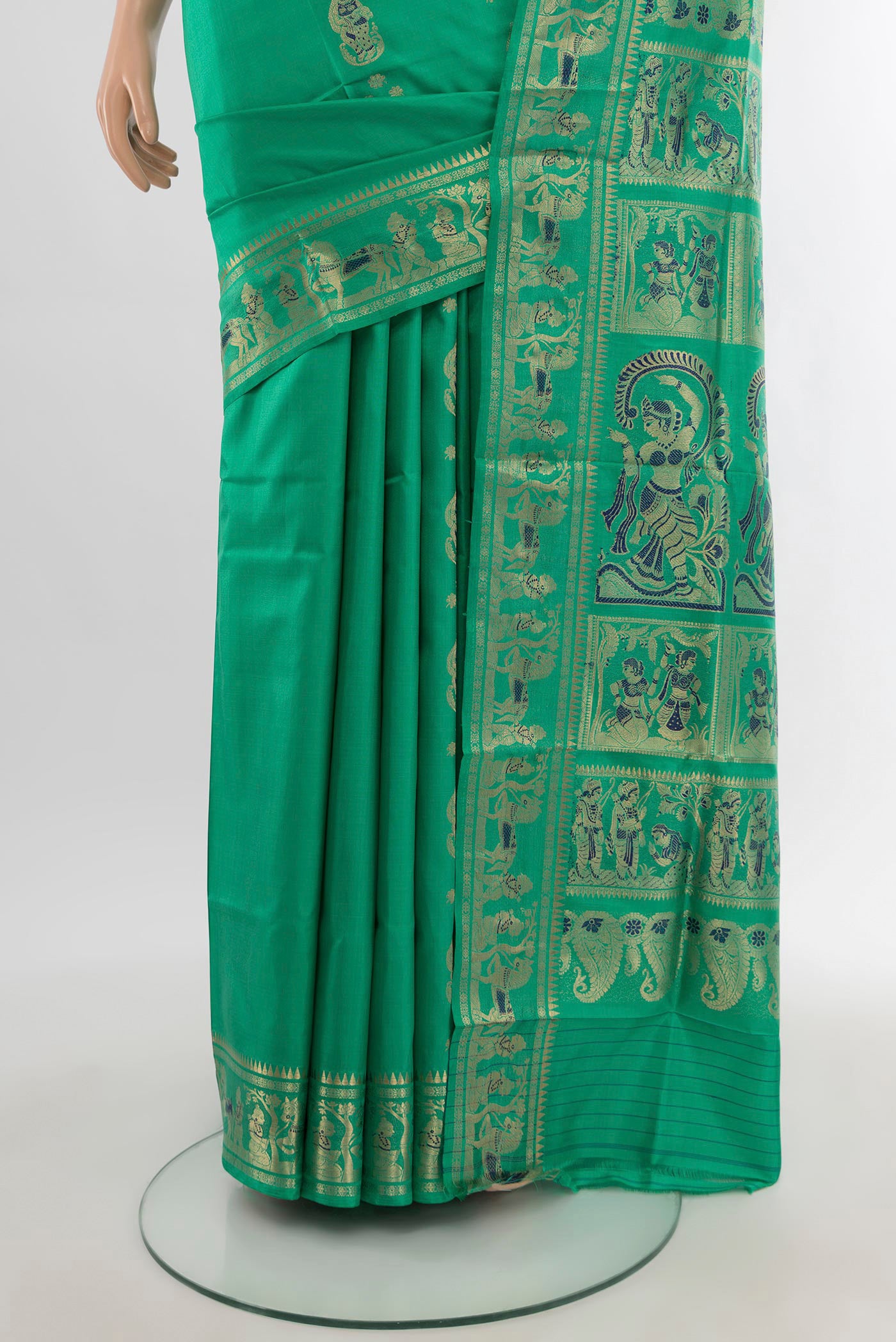 Pleats and pallu of Sea Green Baluchari Silk Saree with Zari And Thread Butta on the body and Zari Border. 
